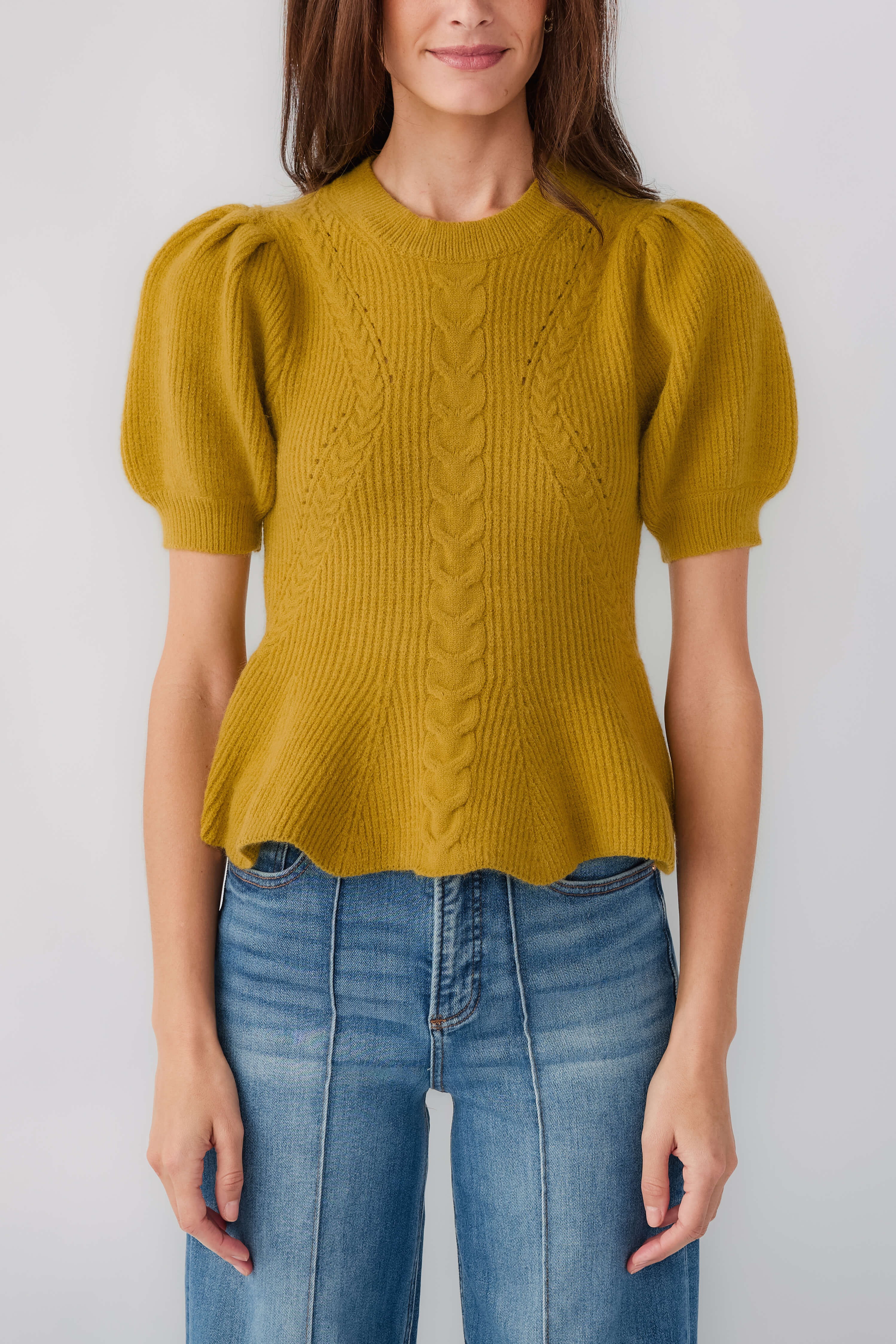 Chartreuse knit top with cable-knit front, puff sleeves, and flared waist