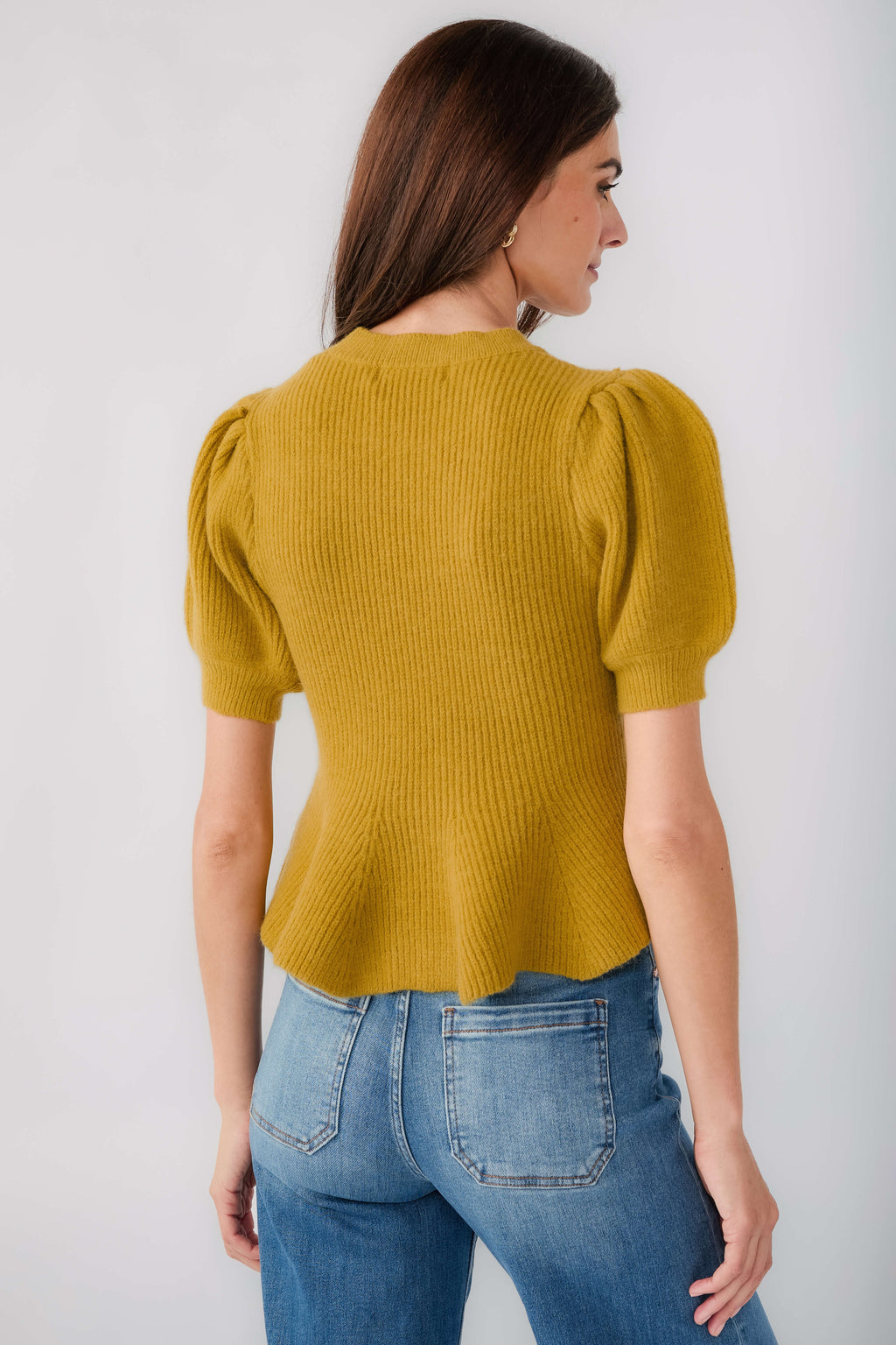 Chartreuse knit top with puff sleeves and ribbed crew neck, flared back hem