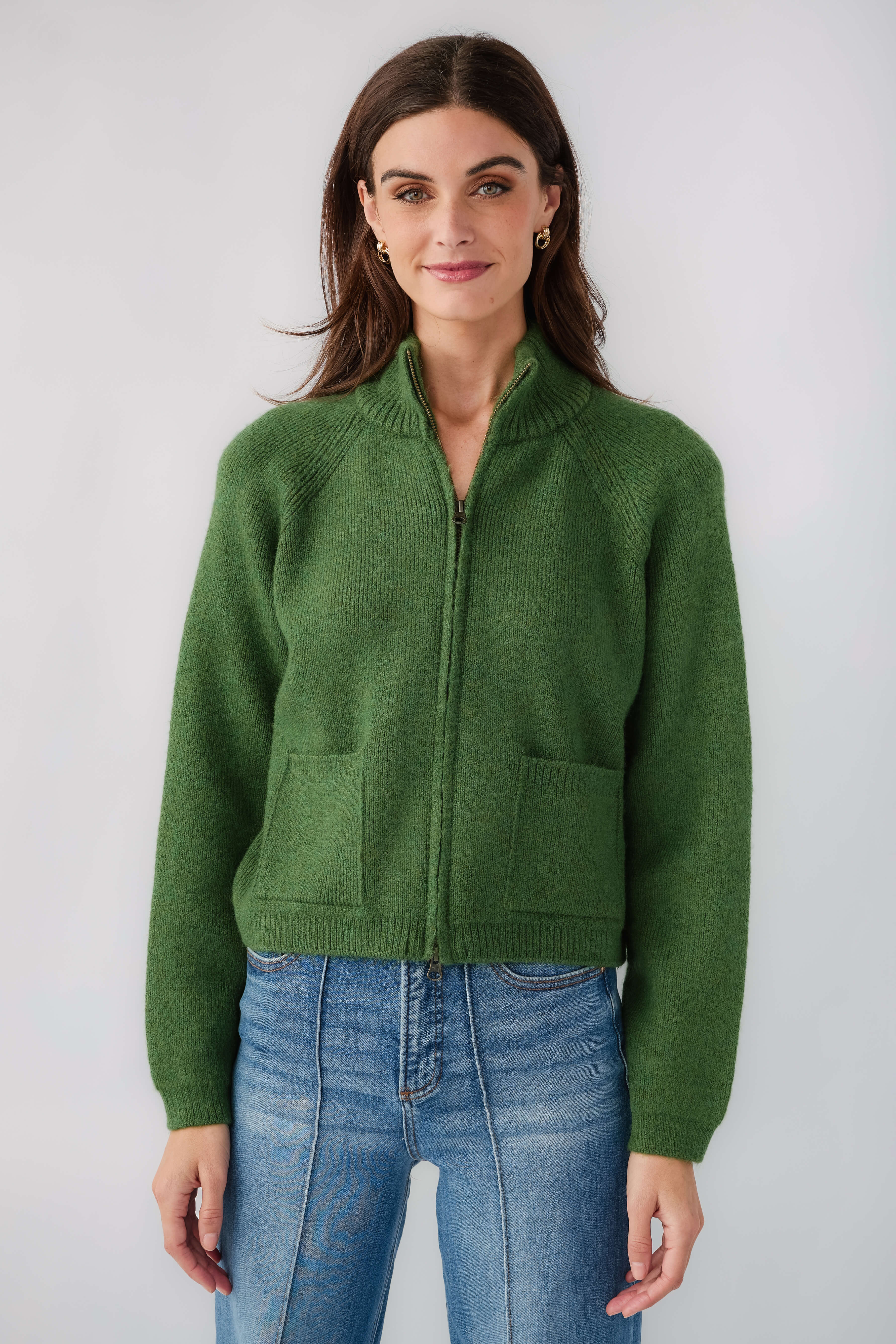 Forest green half-zip knit sweater with chest patch pocket