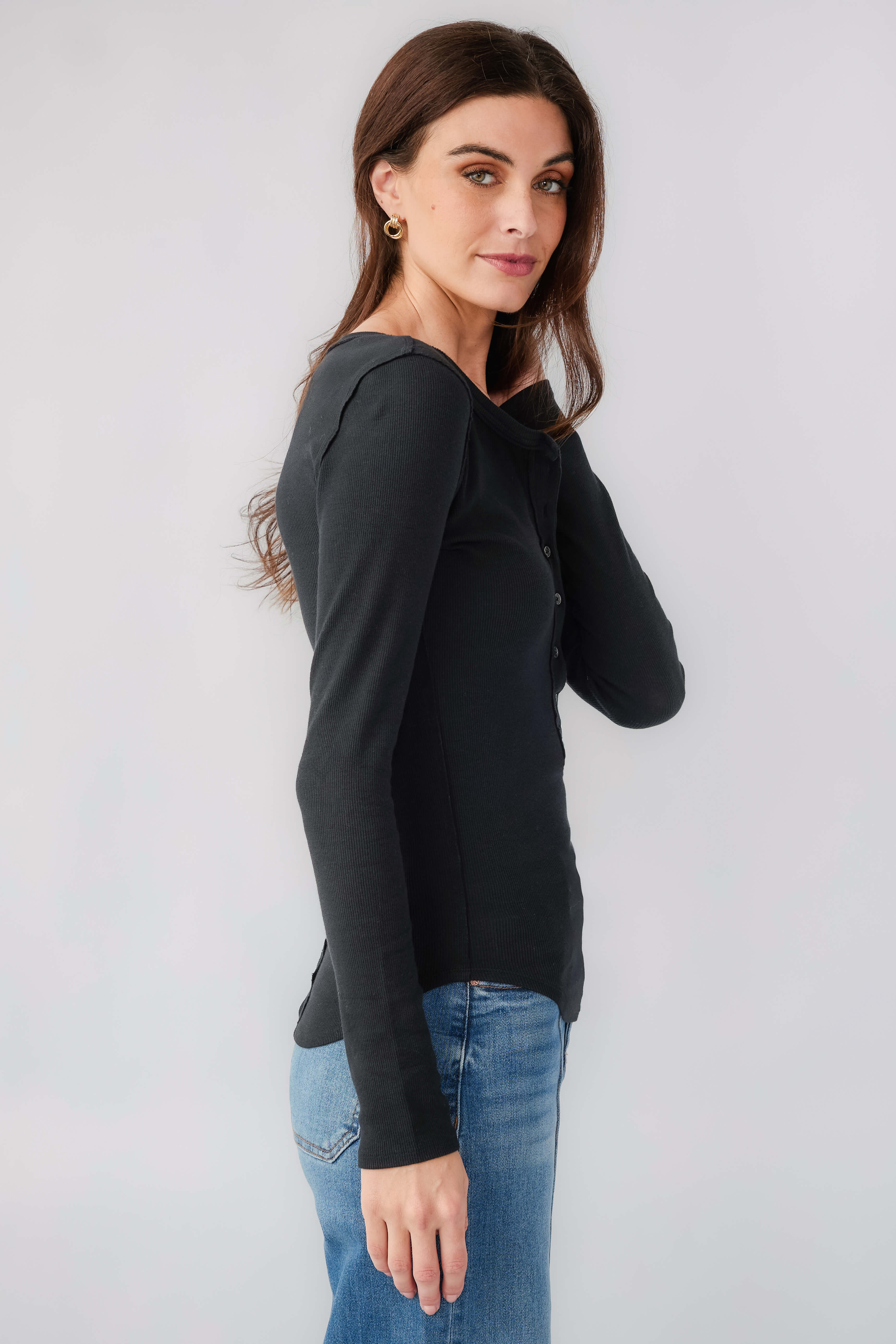 Women's black long-sleeve henley top with button placket and V-neck