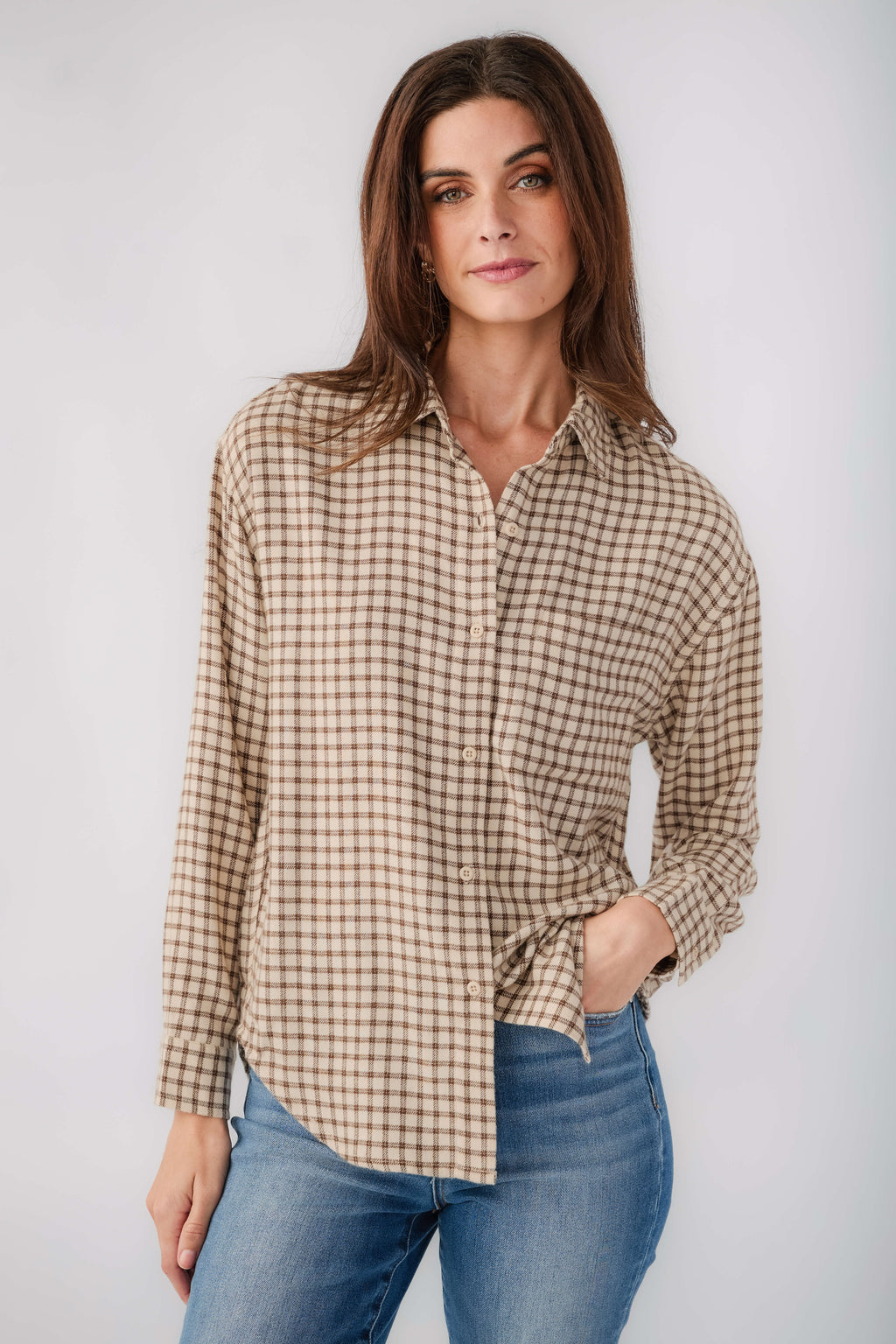 Tan and brown plaid button-up shirt with long sleeves and collar