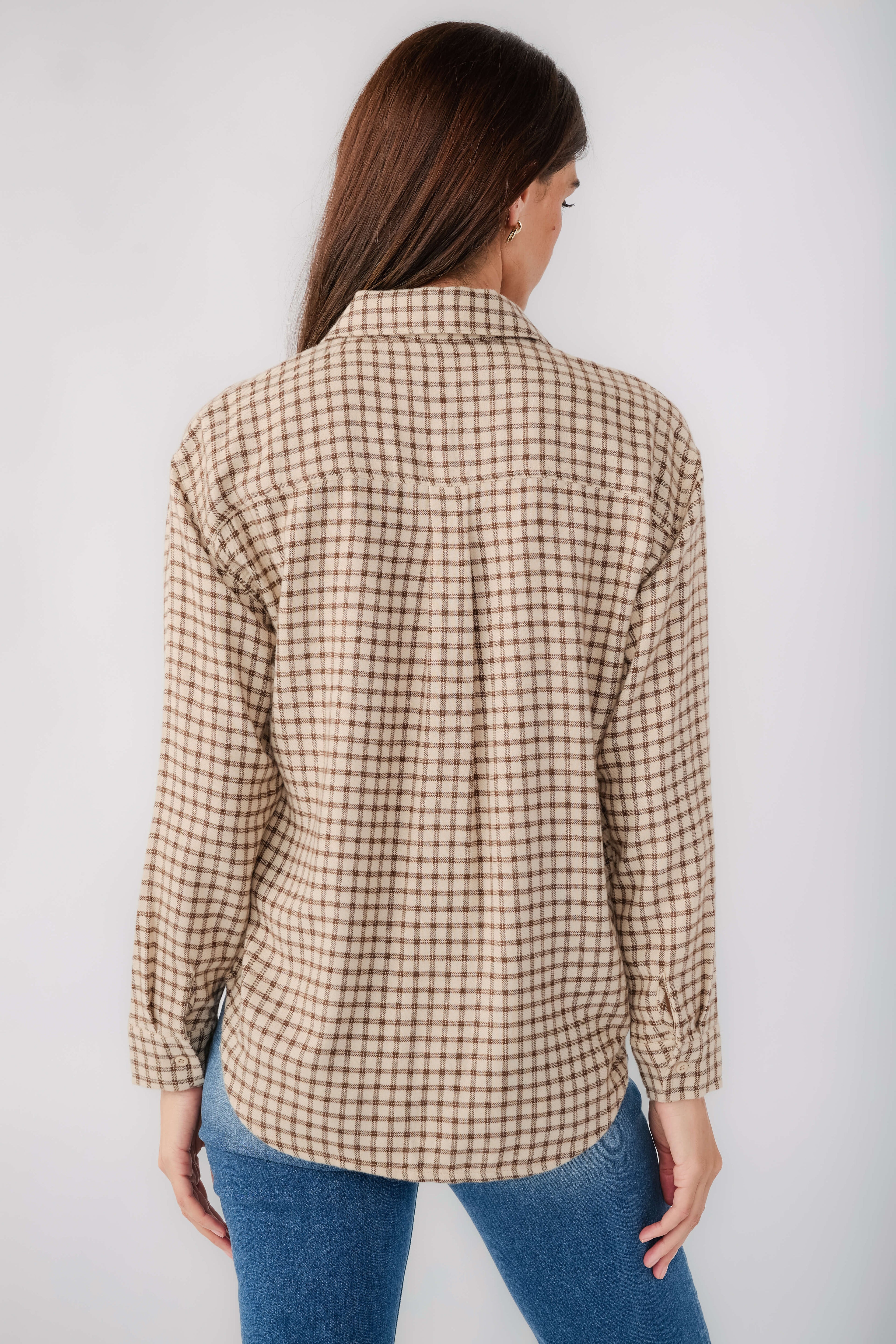 Back view of tan and brown plaid button-up shirt with front buttons