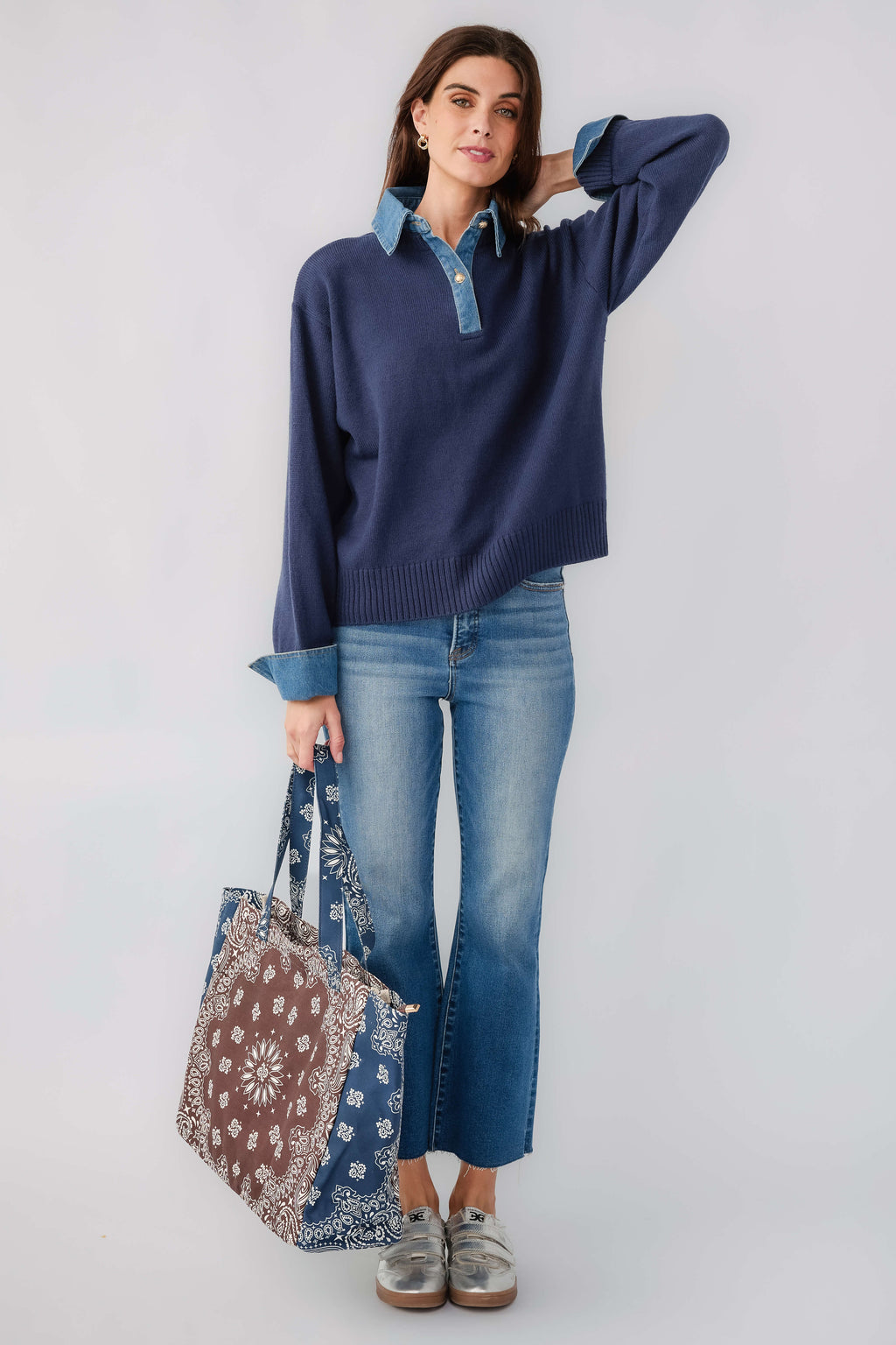 Navy denim polo sweater with button placket, contrast chambray collar and cuffs
