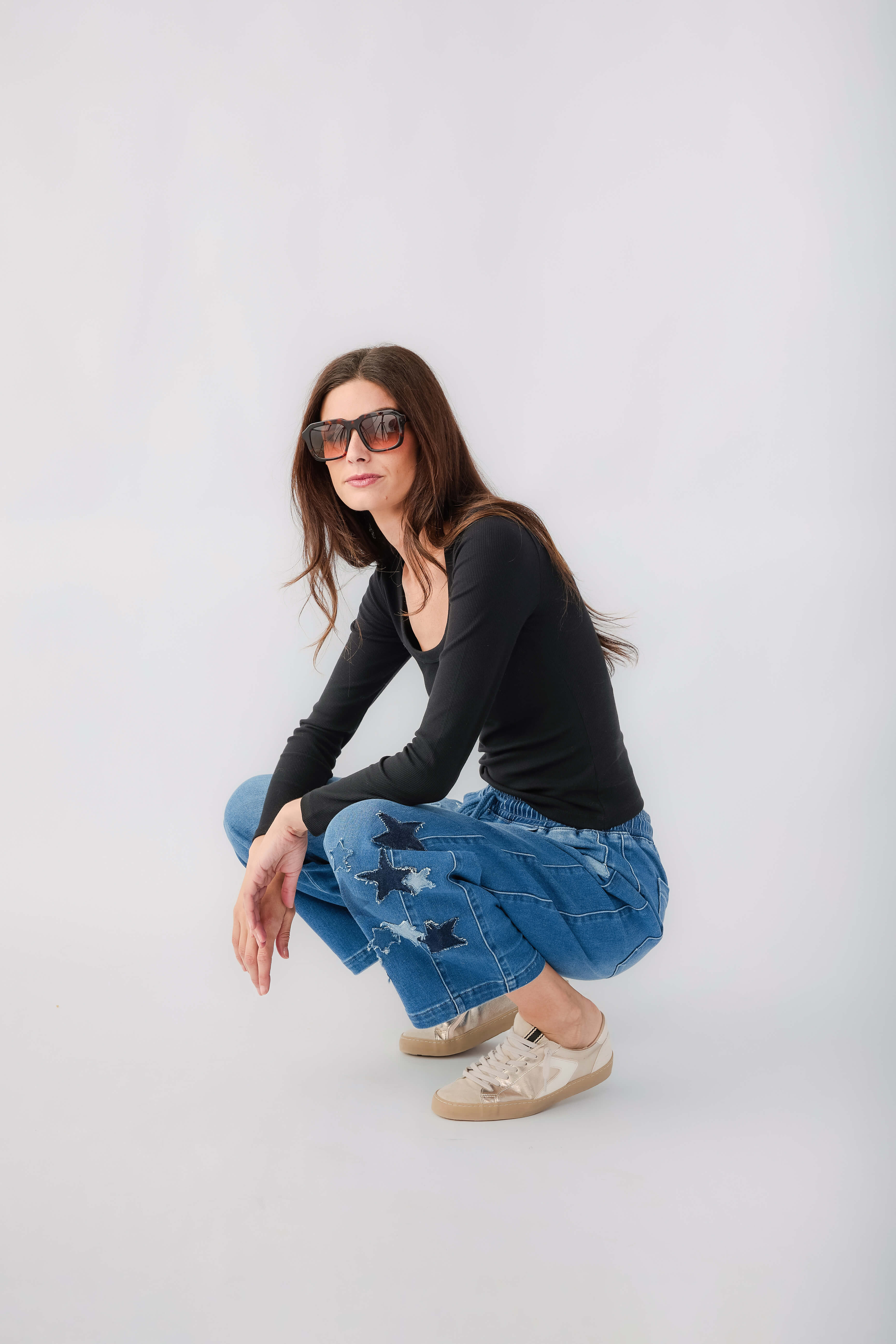 Black long-sleeve scoop-neck tee with wide scoop neckline