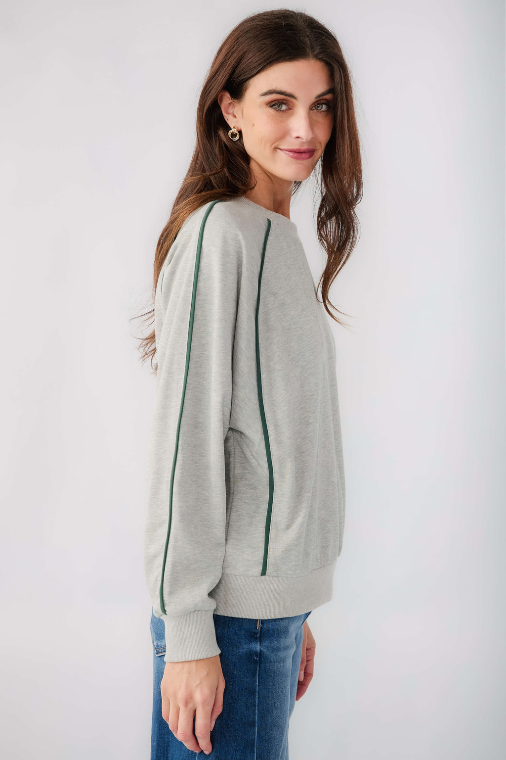 Heather grey raglan sleeve sweatshirt with contrast green piping and crew neckline