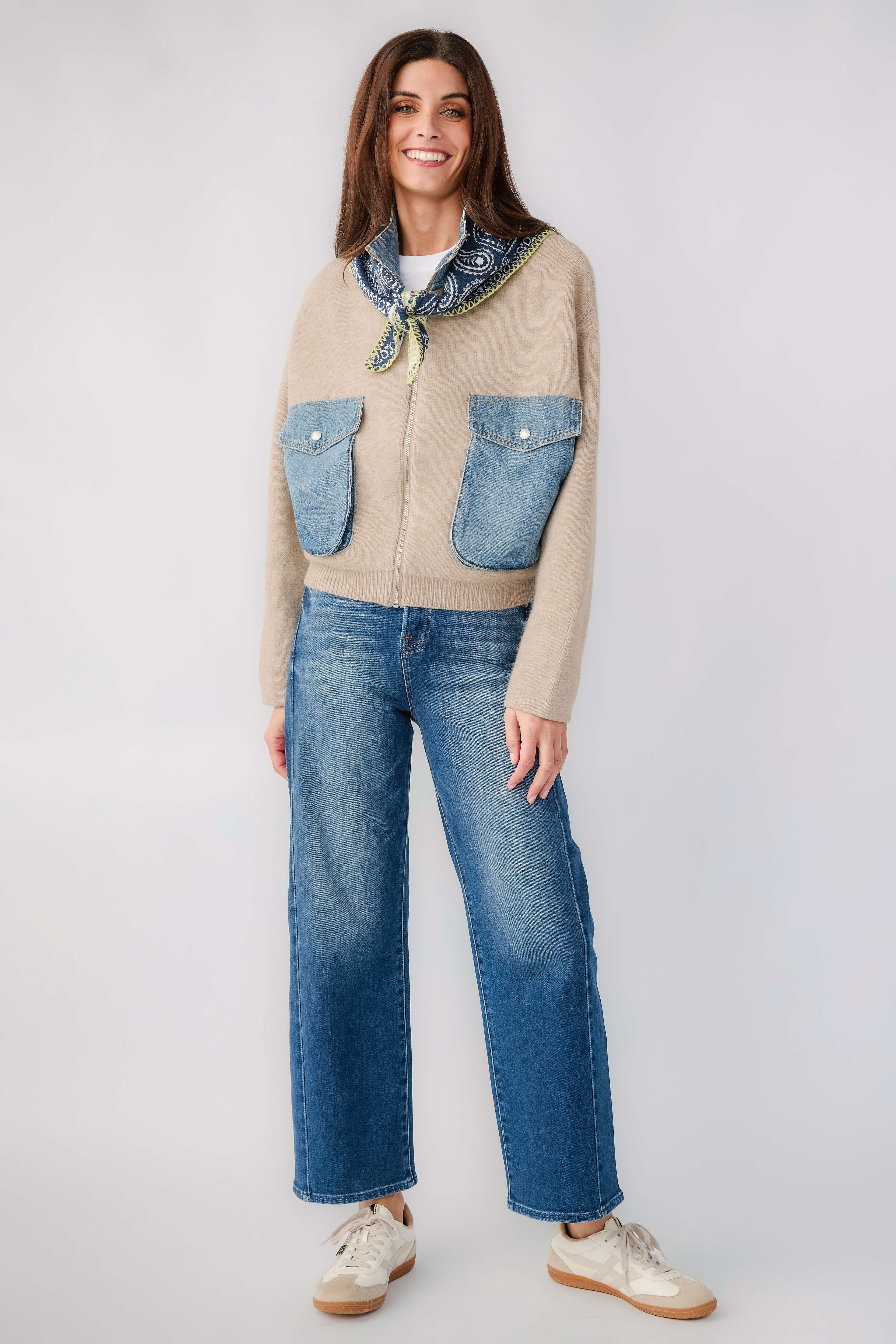 Sweater bomber jacket with blue patch pockets and contrast stand collar, tan knit