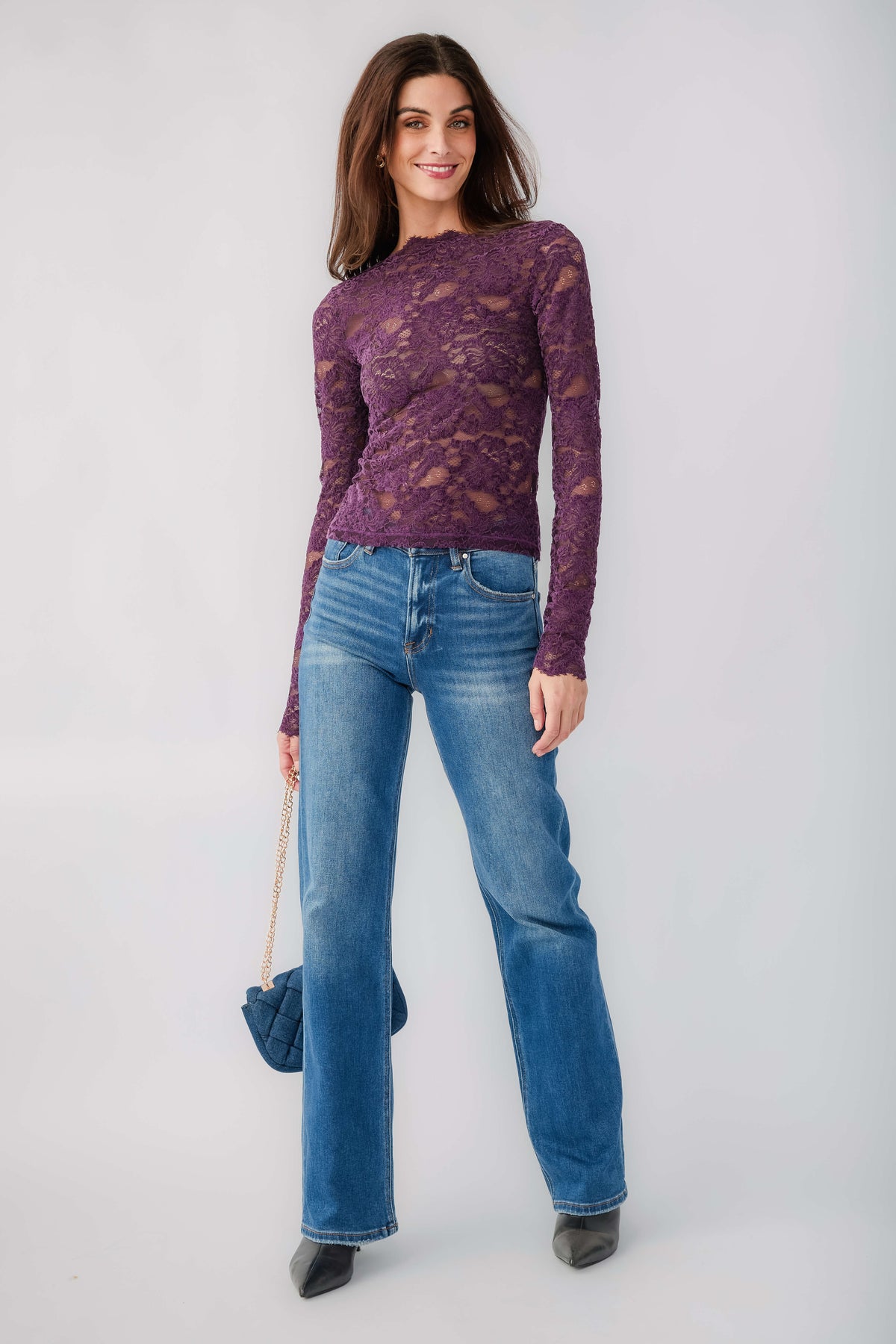 Plum lace top with long sleeves and crew neckline, fitted with textured floral pattern
