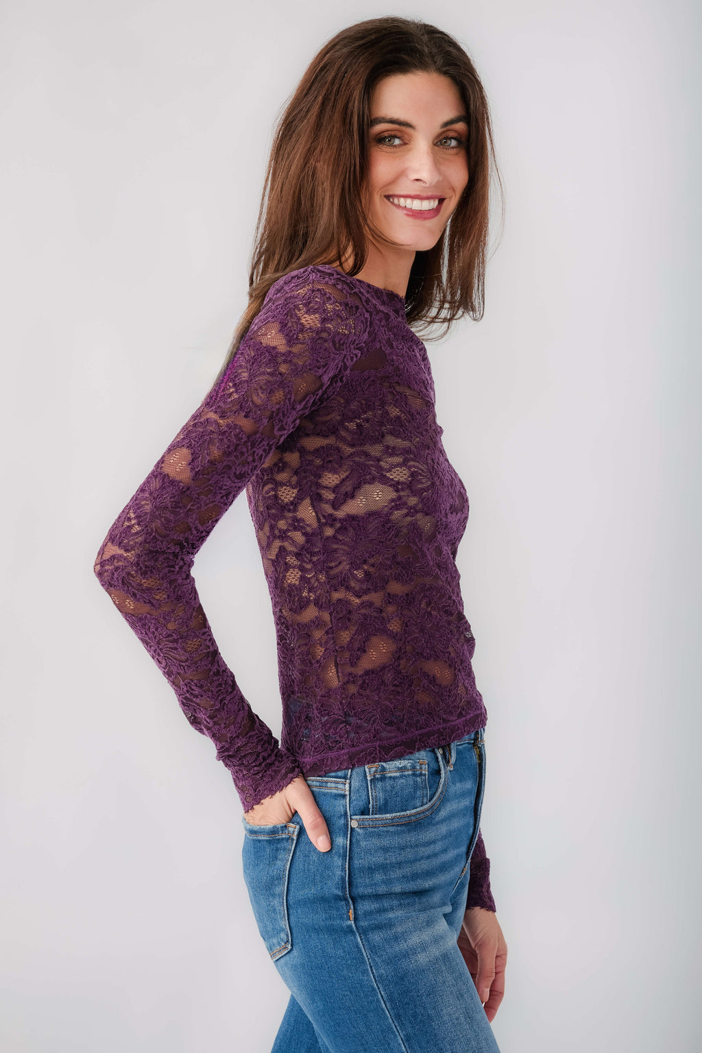 Plum lace long-sleeve top with crew neckline, textured floral lace pattern
