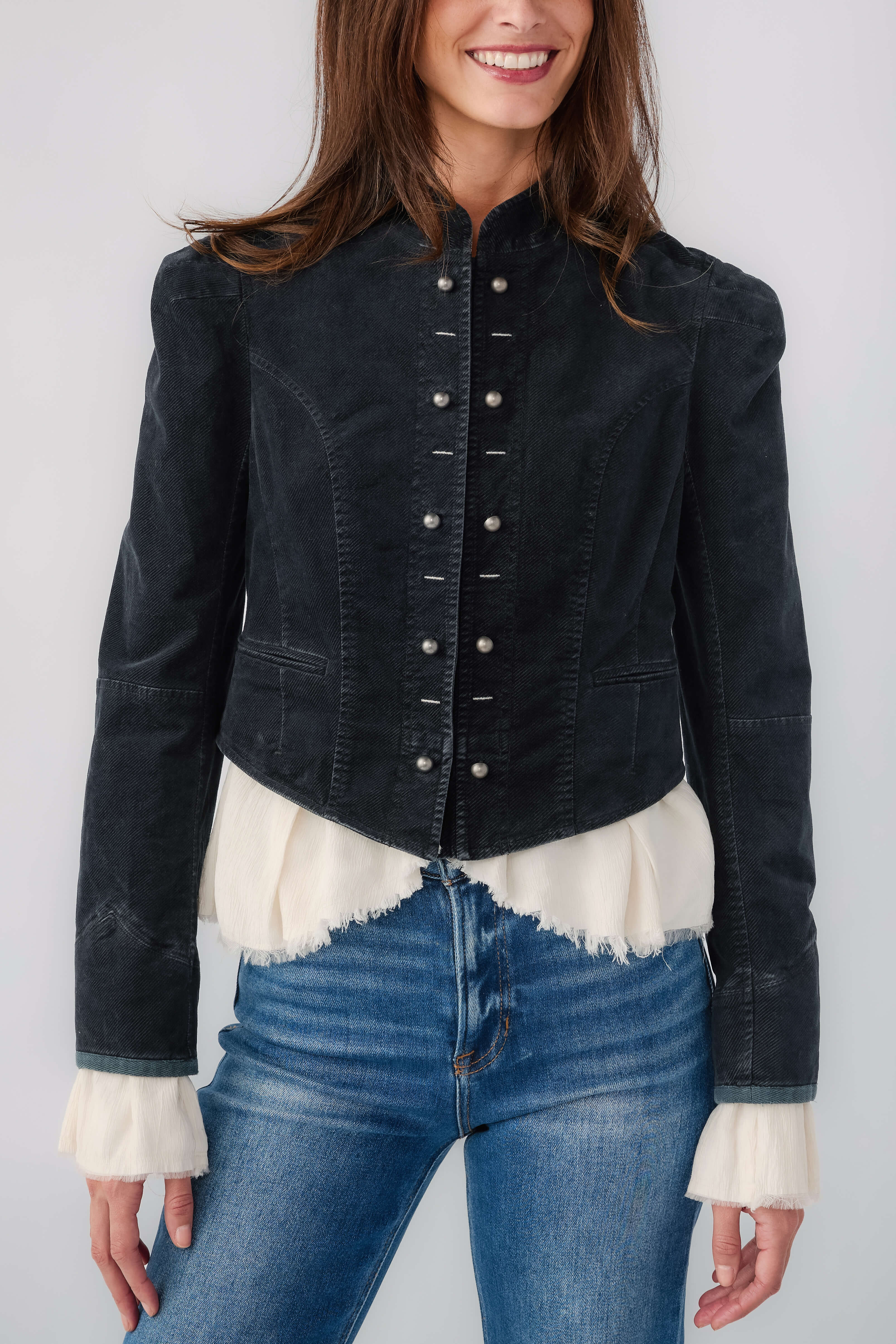 Black denim blazer with brass button front and white ruffled cuffs