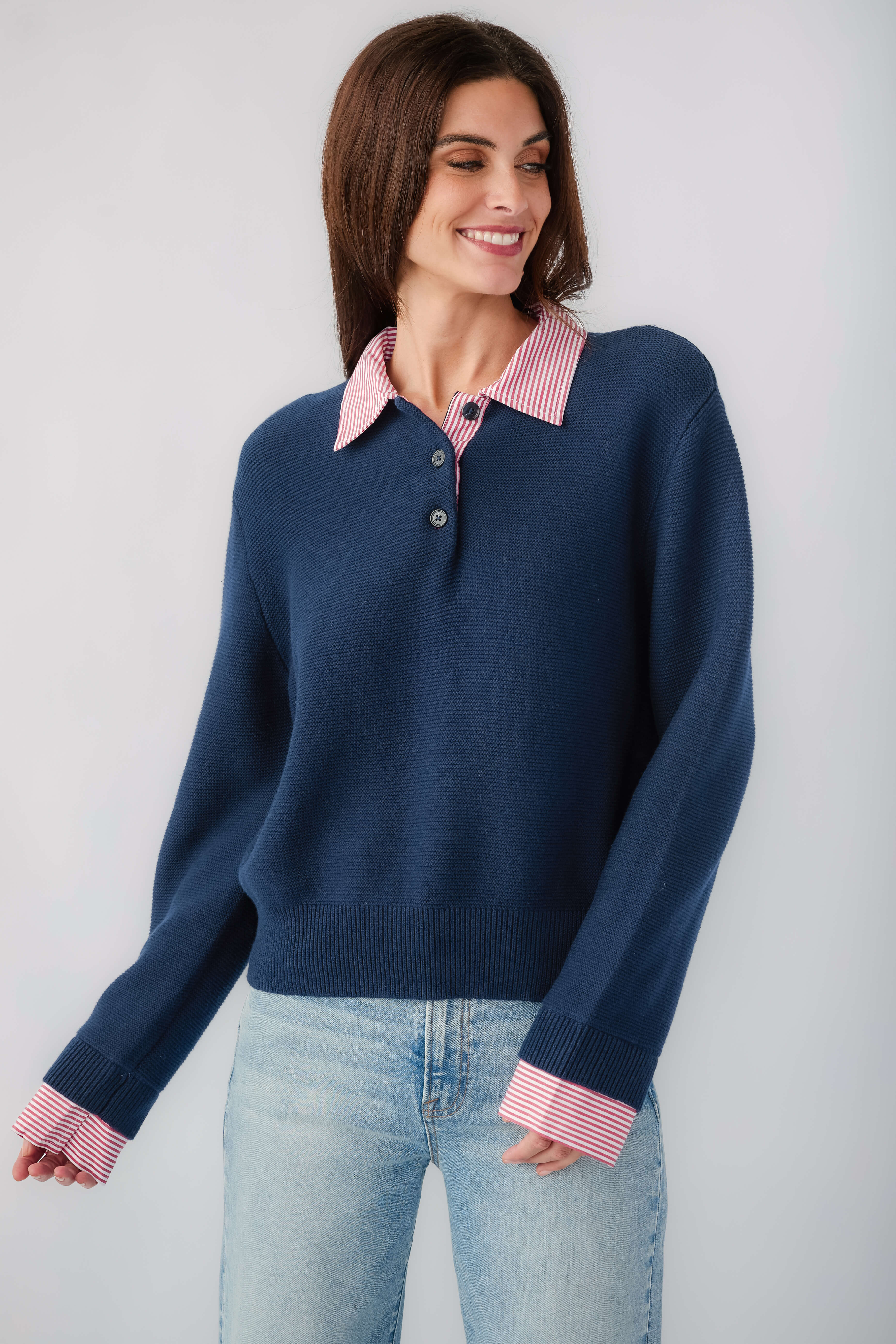 Navy knit sweater with striped pink-red collar and cuffs, long sleeves