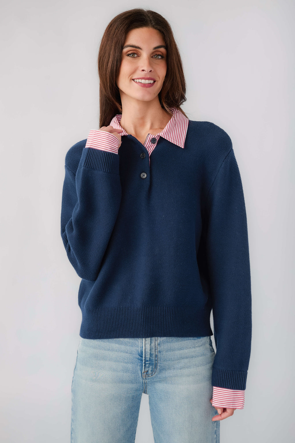 Navy knit sweater with striped collar and cuffs, buttoned neckline