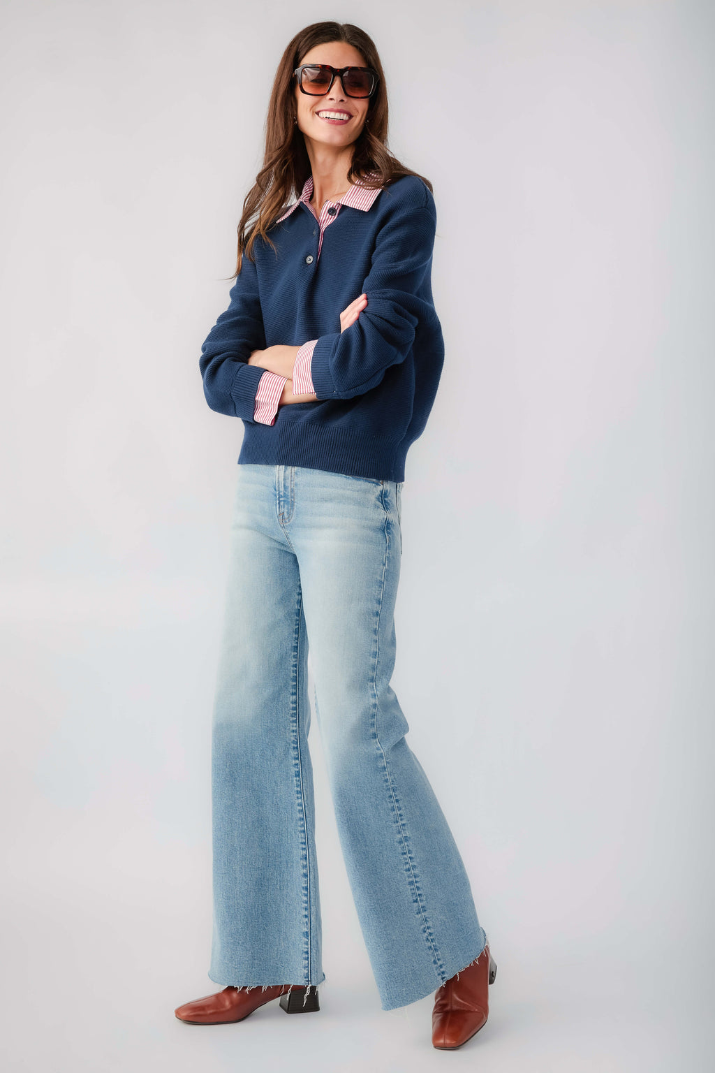 Navy knit sweater with striped collar and cuffs, long sleeves