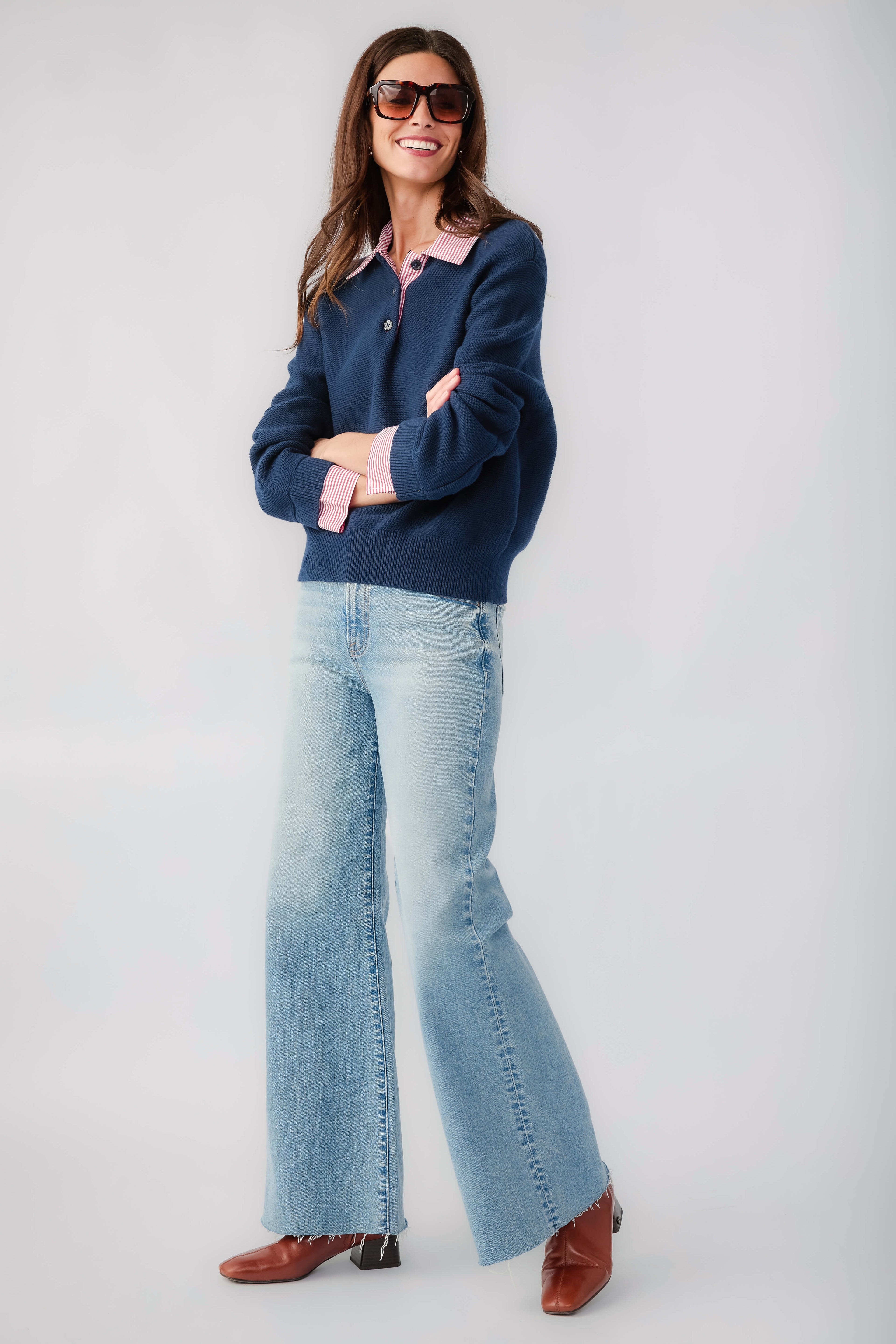 Navy knit sweater with striped collar and cuffs, long sleeves