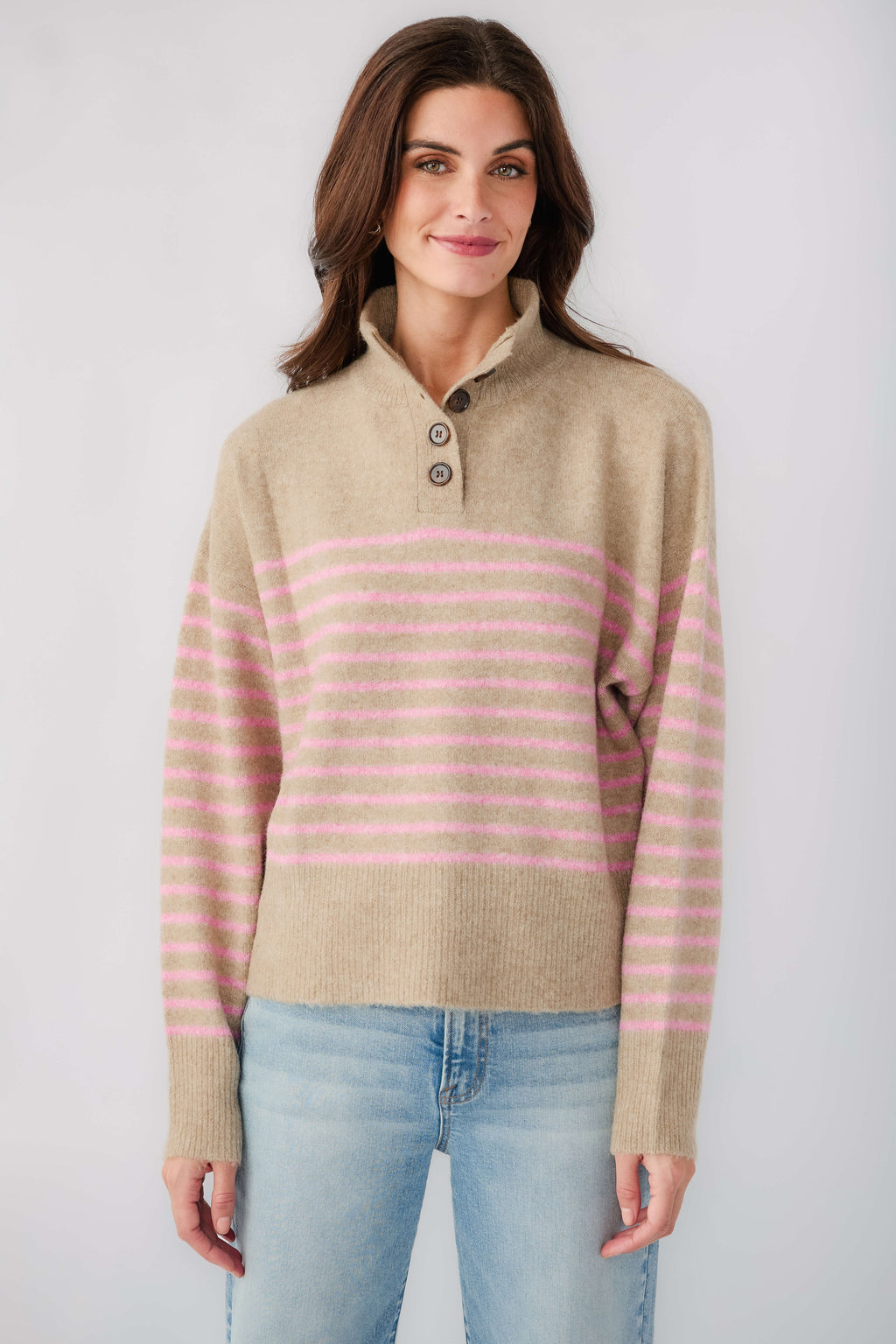 Mocha knit pullover with pink horizontal stripes and half-button placket at neckline