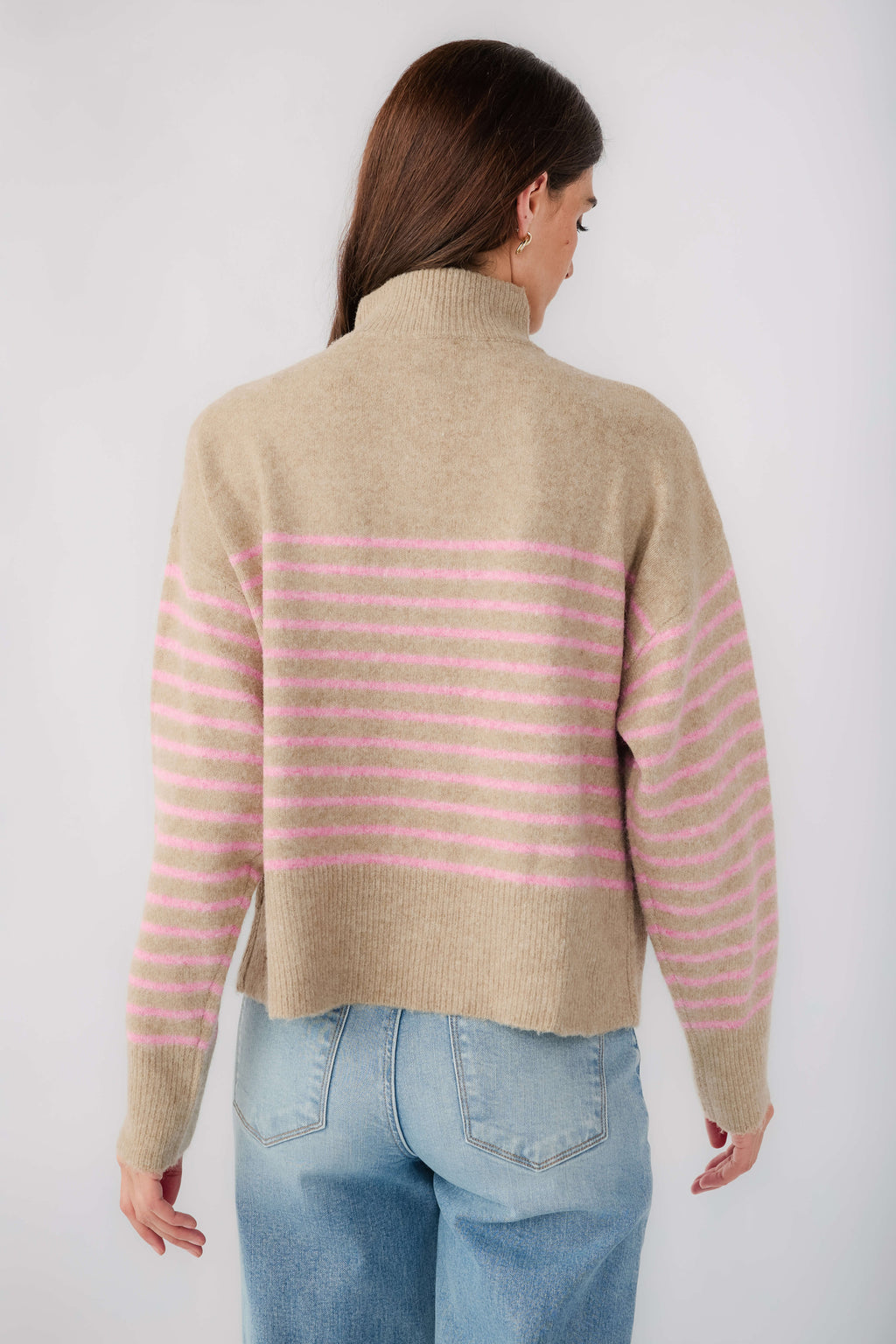 Mocha knit pullover with pink striped back, long sleeves, and half-button collar