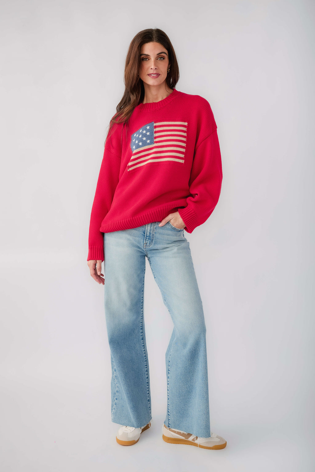 Red crewneck sweater with American flag graphic on the chest and ribbed hem