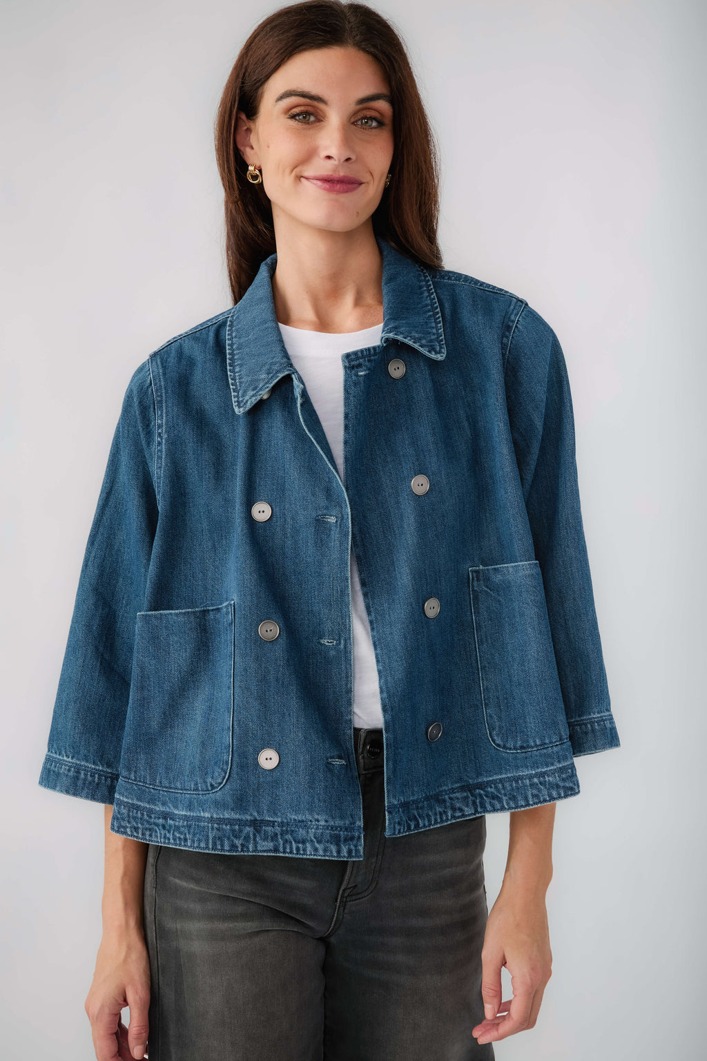 Dark blue cropped denim jacket front view with turn-down collar and flap pockets
