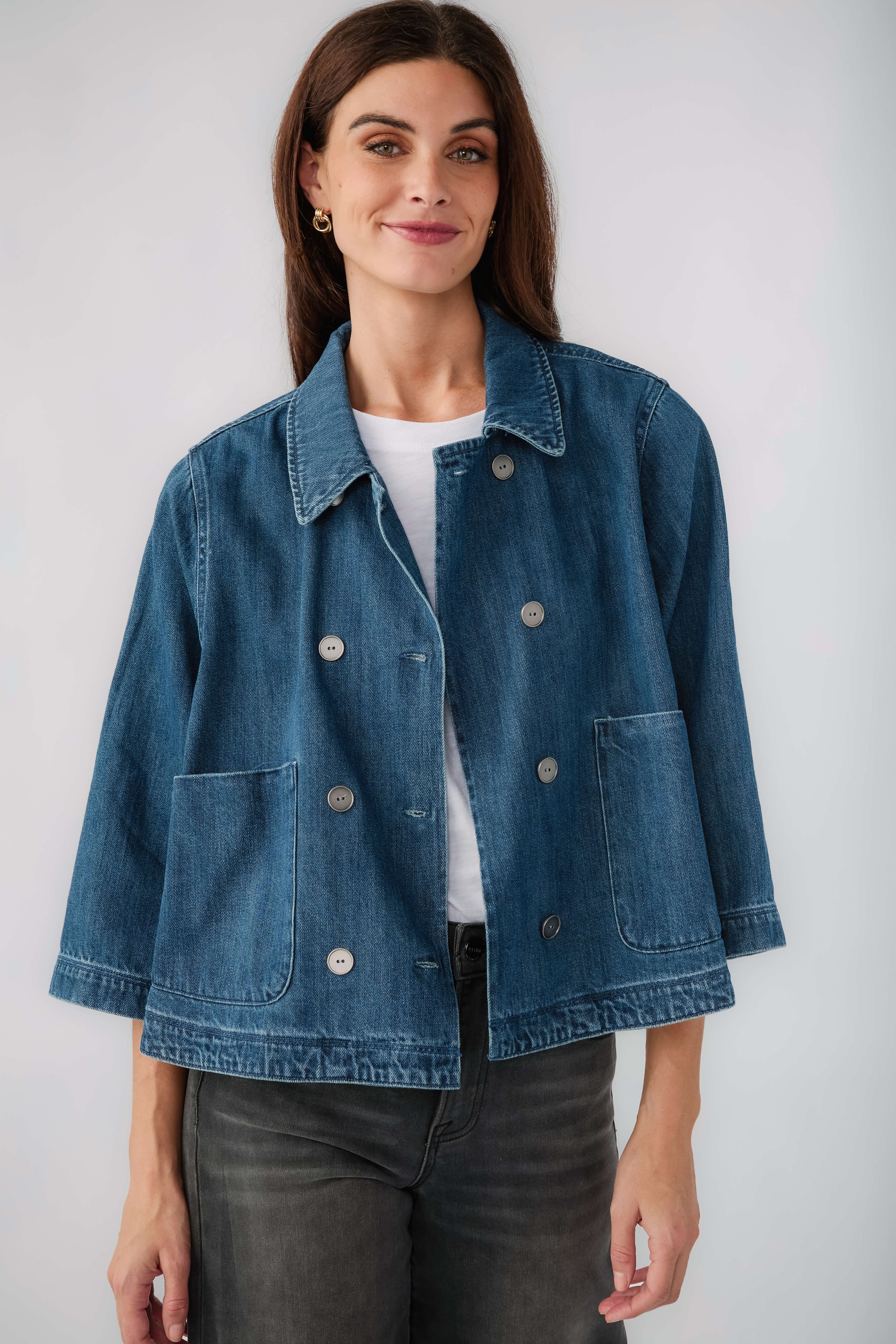 Dark blue cropped denim jacket front view with turn-down collar and flap pockets