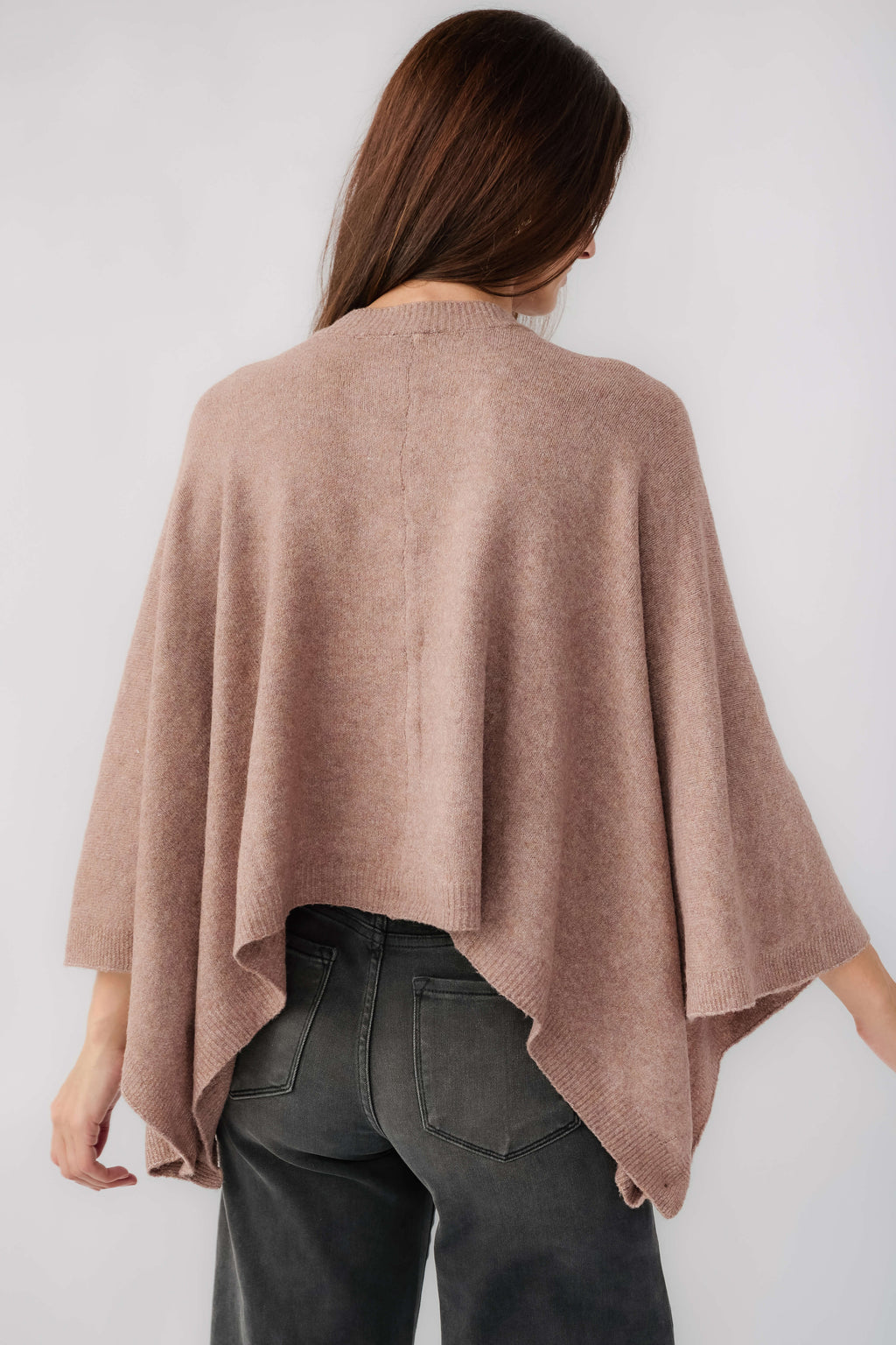 Mushroom poncho sweater with back drape, cape-like sleeves, and rounded neckline