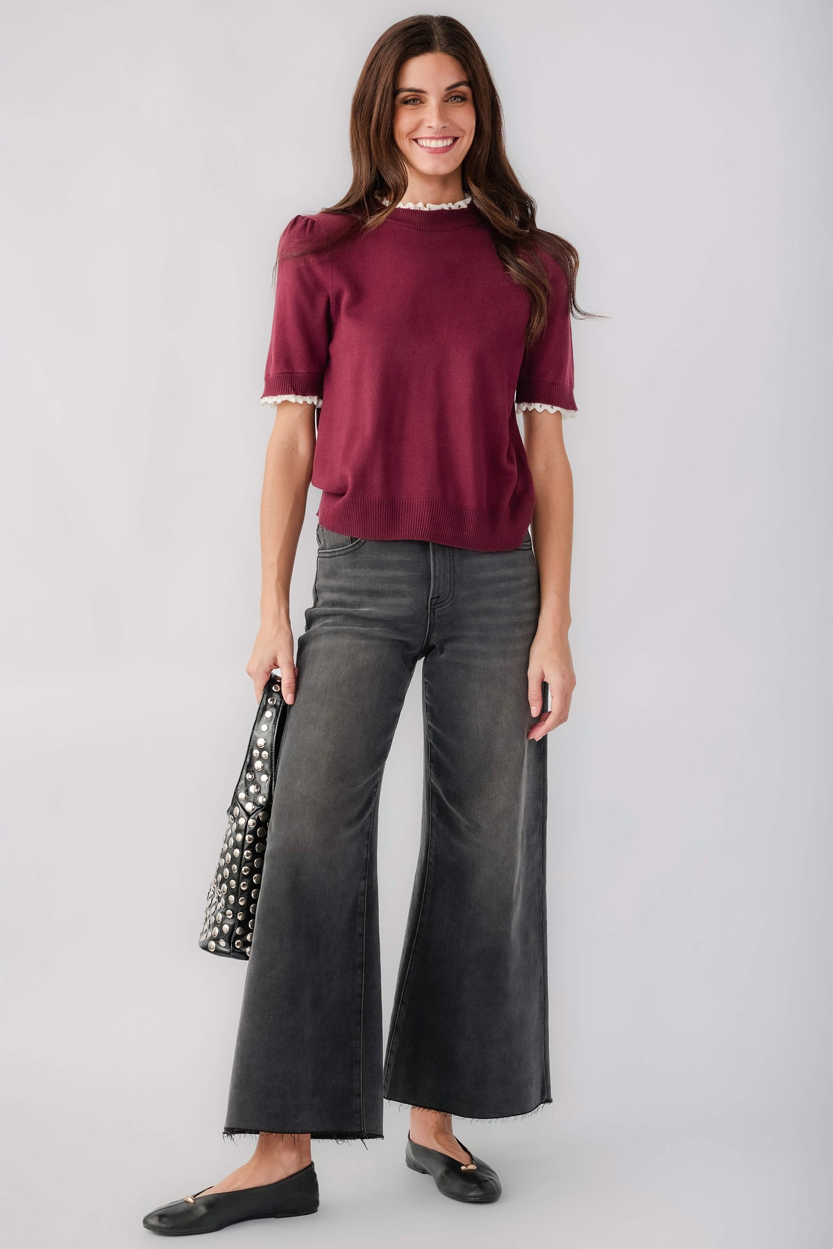Wine knit top with mock neck and white lace trim at cuffs and hem