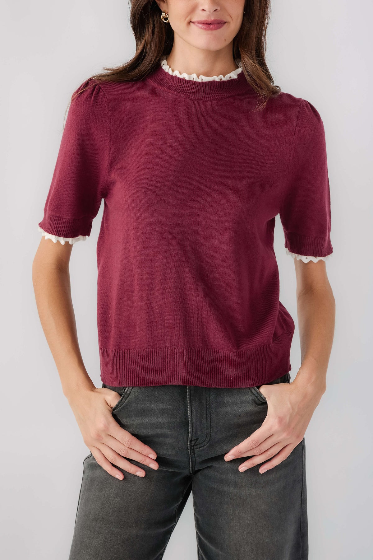 Wine mock-neck knit top with white lace trim neckline and sleeves