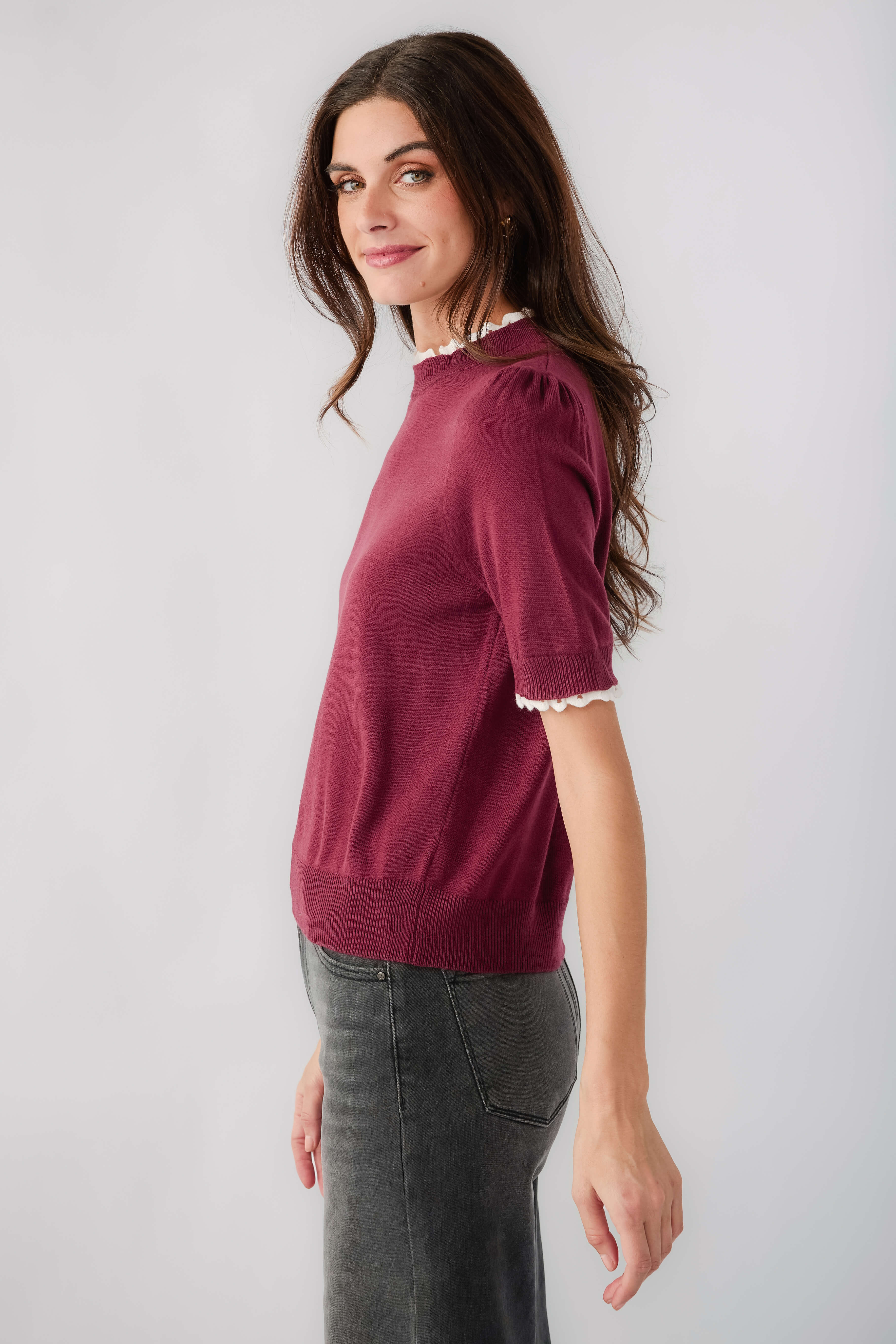 Wine knit mock-neck top with short sleeves and white lace-trim cuff detail