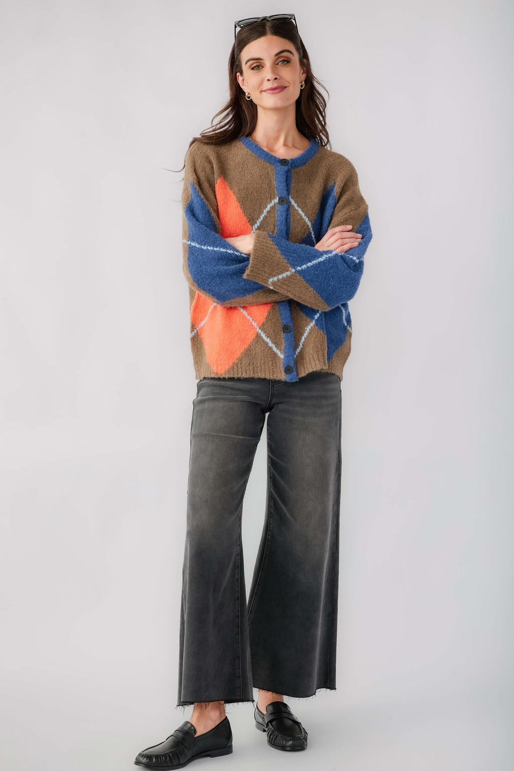 Kaki argyle cardigan with button placket, blue and orange diamond pattern, crew neckline.