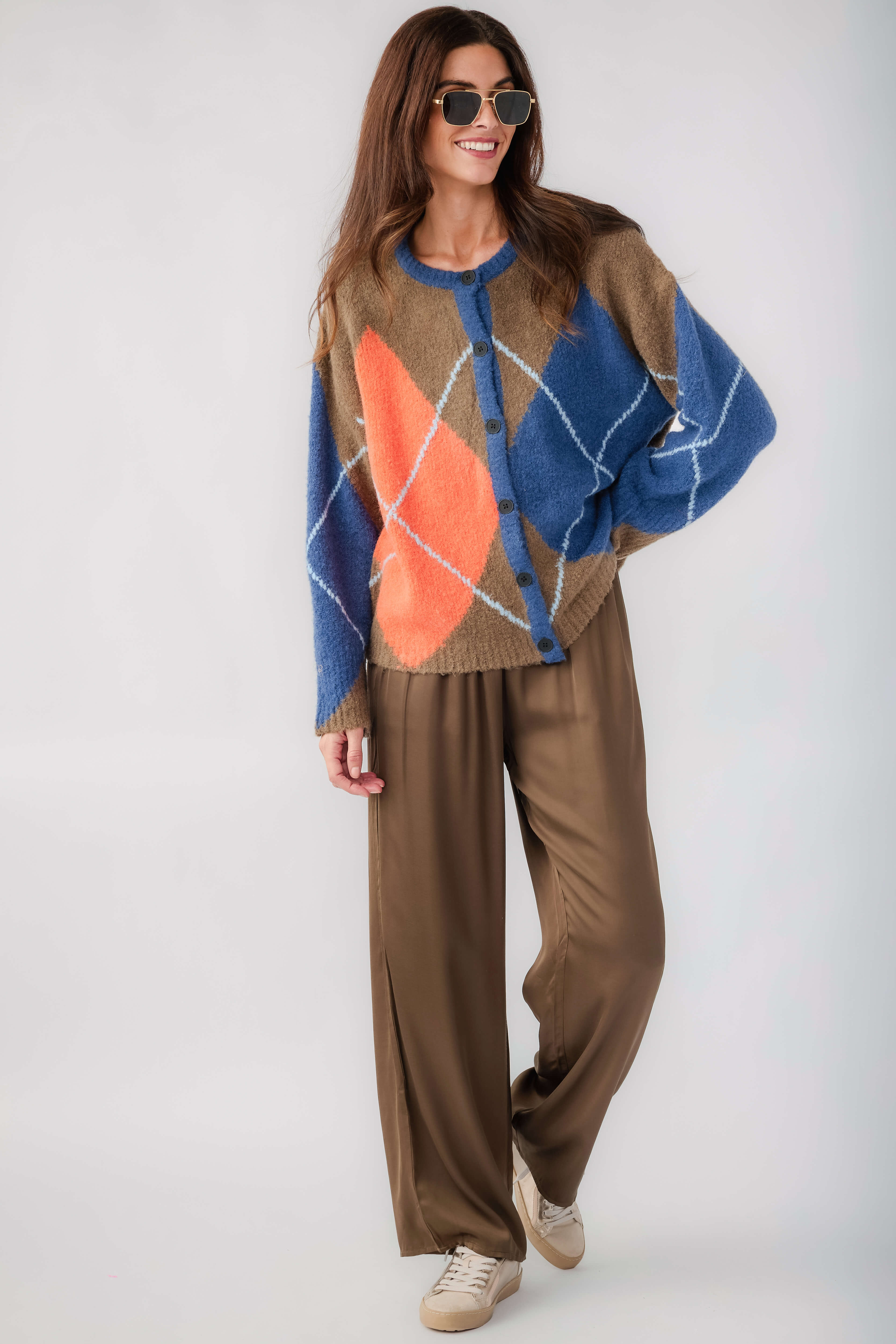 Kaki argyle cardigan with button front, wide blue and orange diamond design.