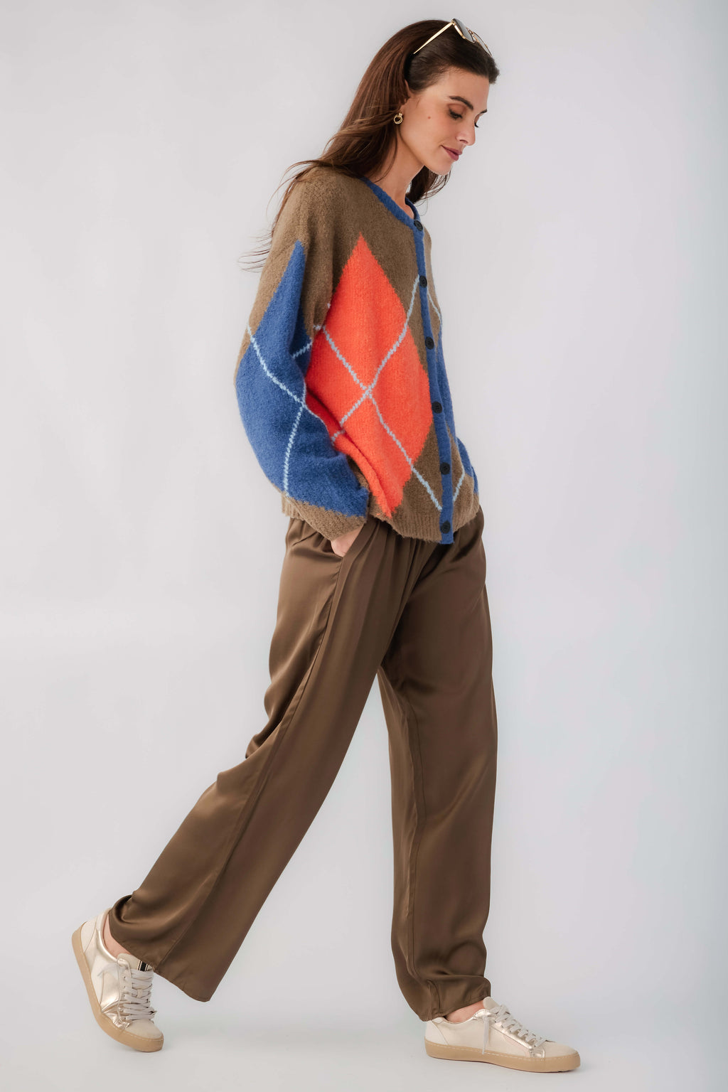 Kaki argyle cardigan with button front, blue and orange diamond pattern, long sleeves.