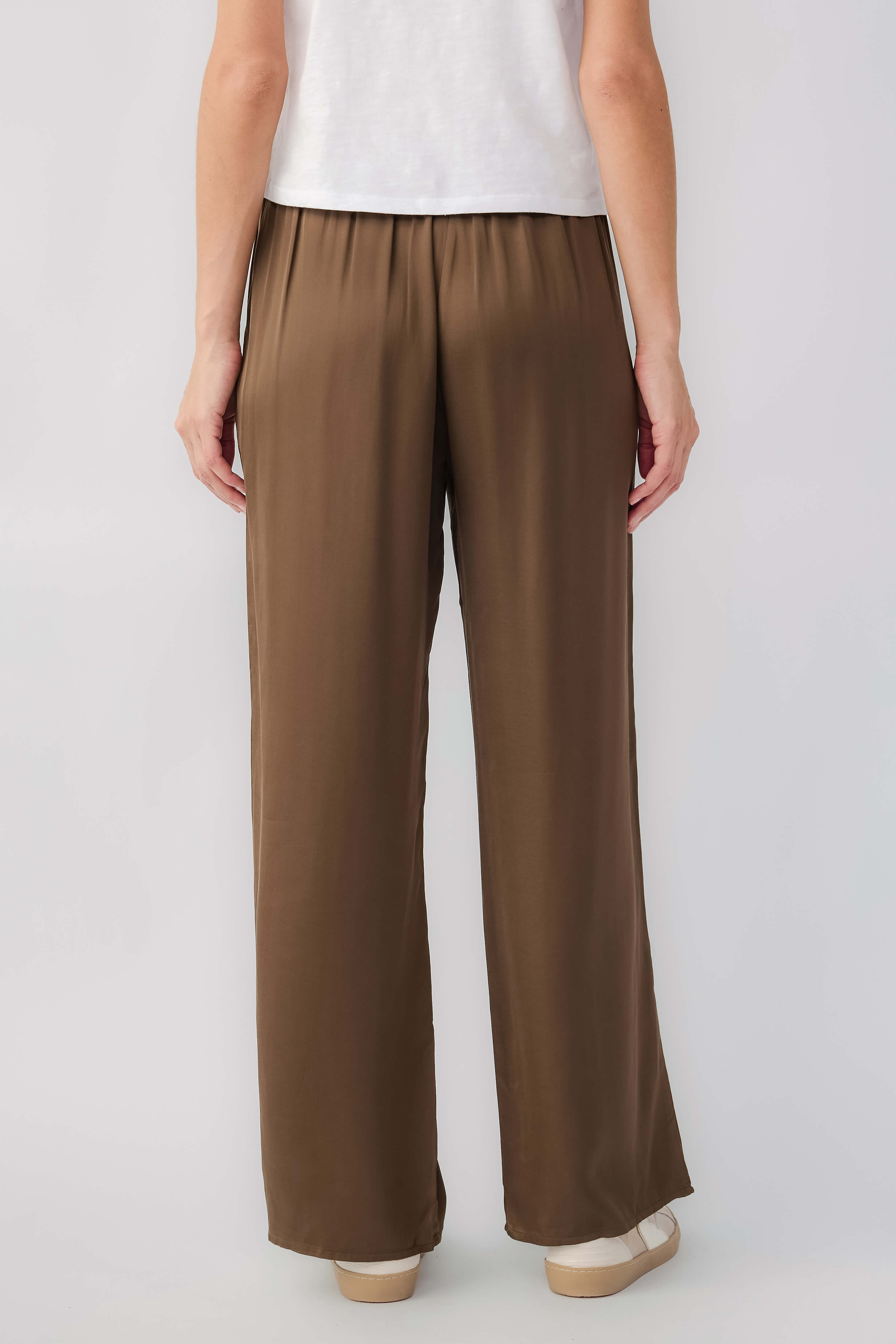 Olive satin wide-leg pants with gathered elastic waistband and loose straight legs