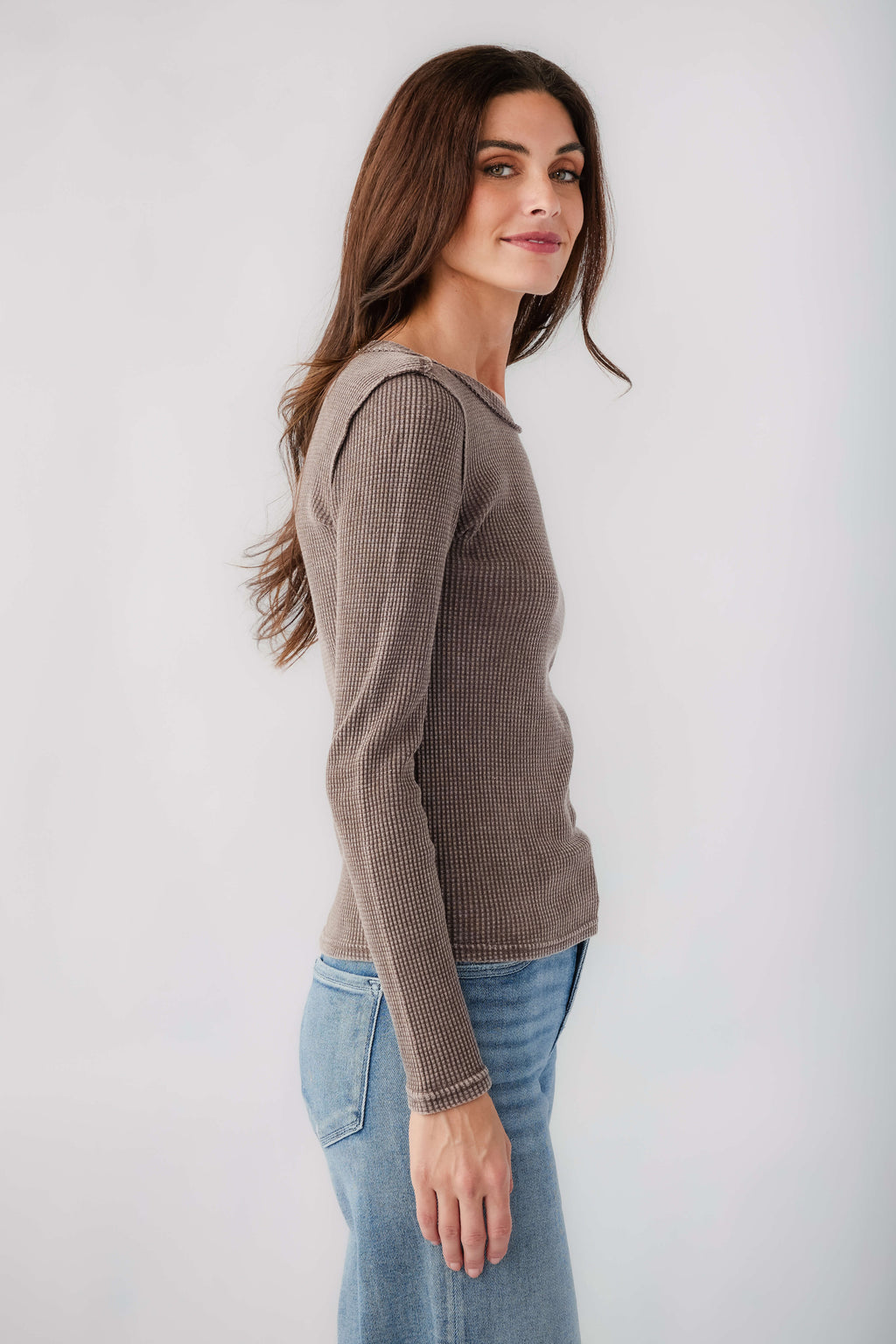 Taupe thermal top with crew neck and long sleeves, side view