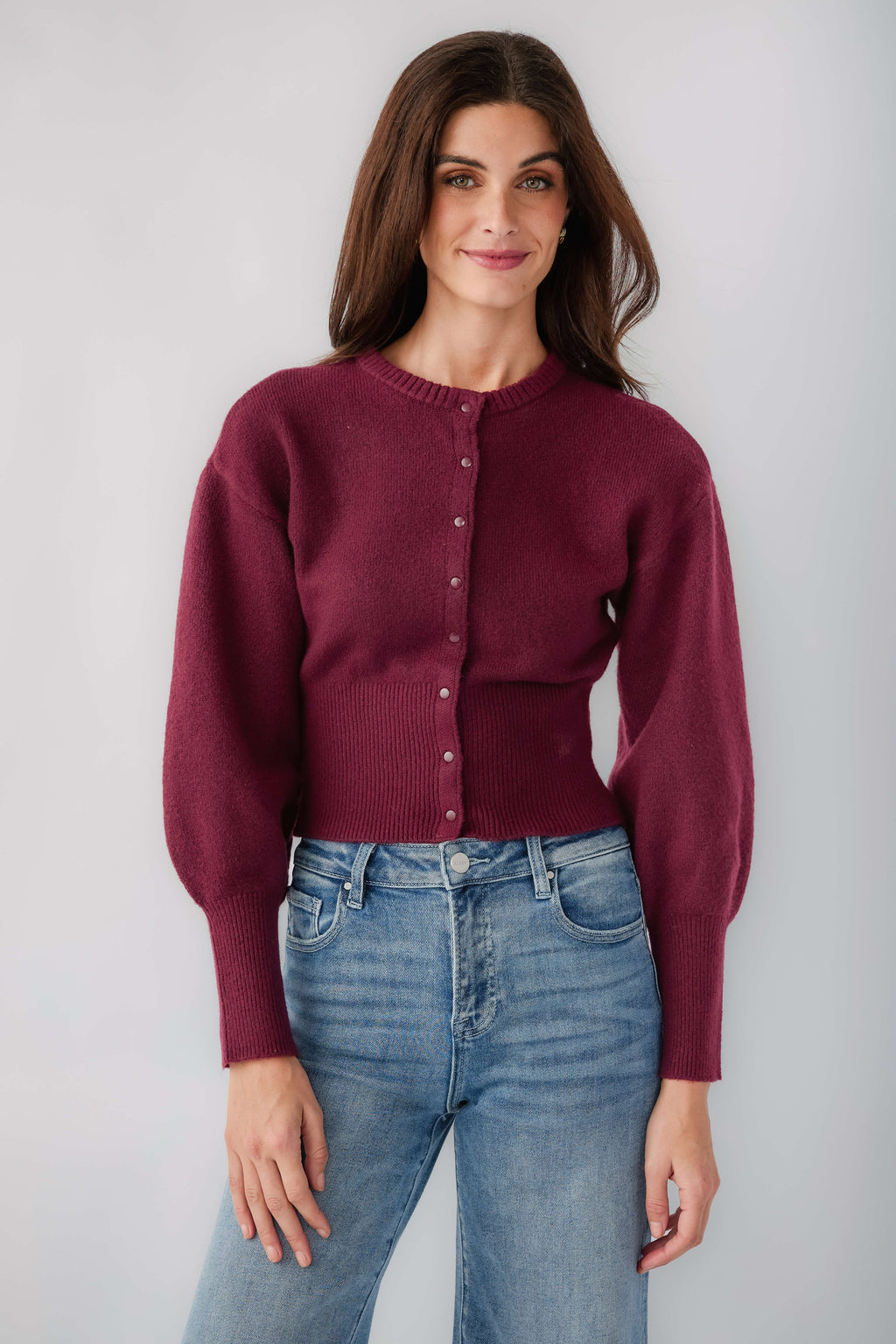 Deep burgundy crew-neck button cardigan with long sleeves and front patch pockets