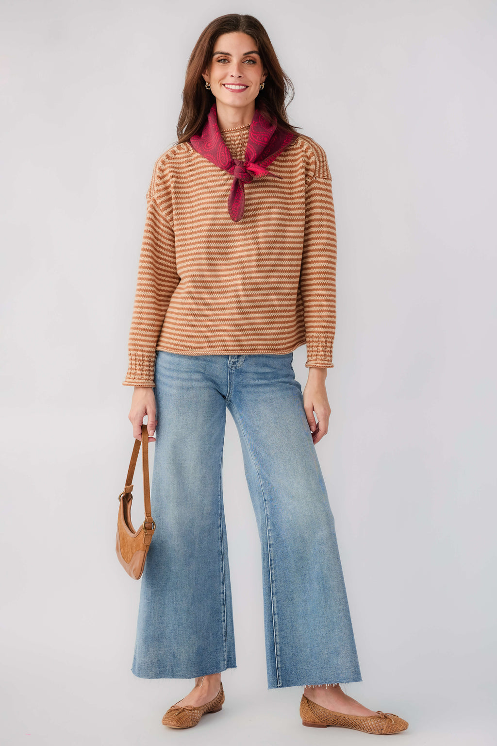 Orange-and-cream striped long-sleeve funnel neck sweater with ribbed cuffs