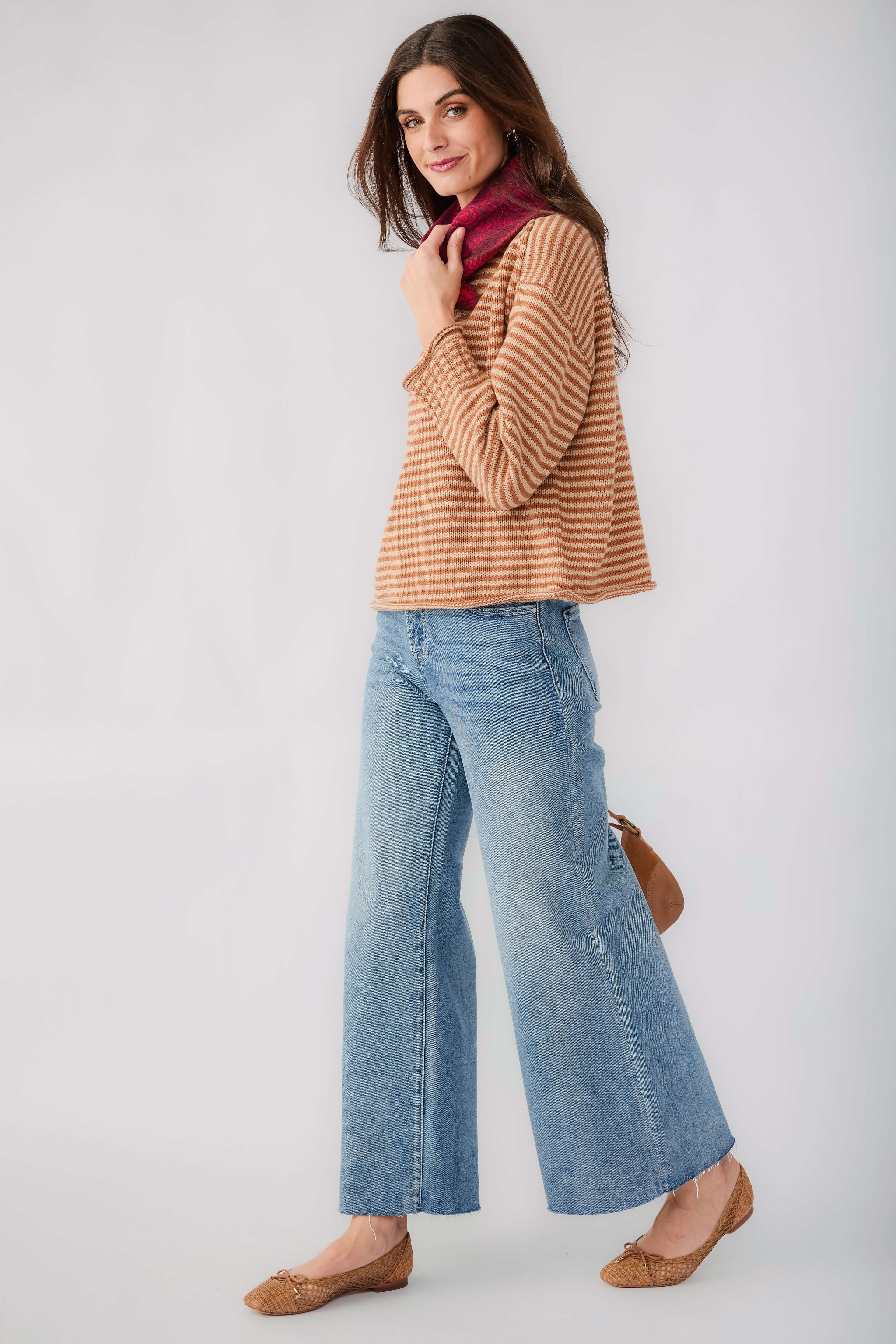 Medium blue wide-leg denim jeans with raw hem and wide flared legs