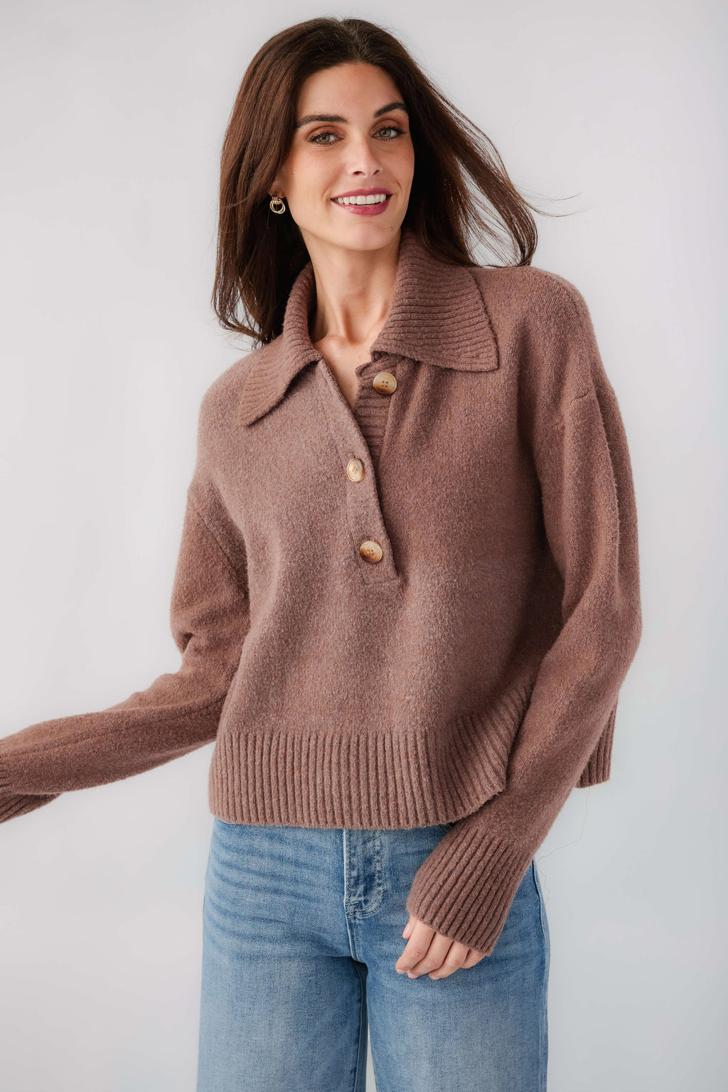 Brown knit polo sweater with turn-down collar and button placket, long sleeves, ribbed hem