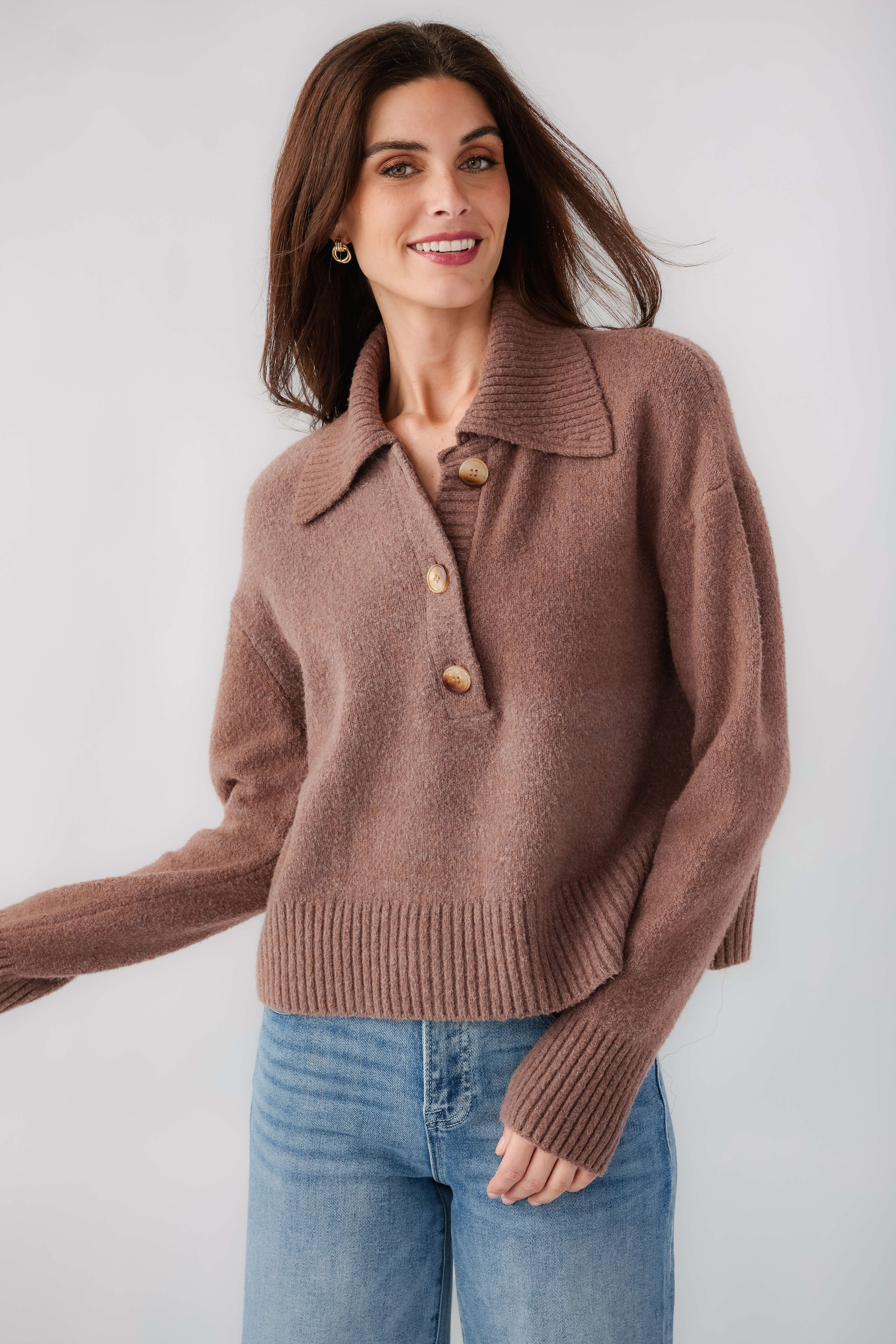 Brown knit polo sweater with turn-down collar and button placket, long sleeves, ribbed hem