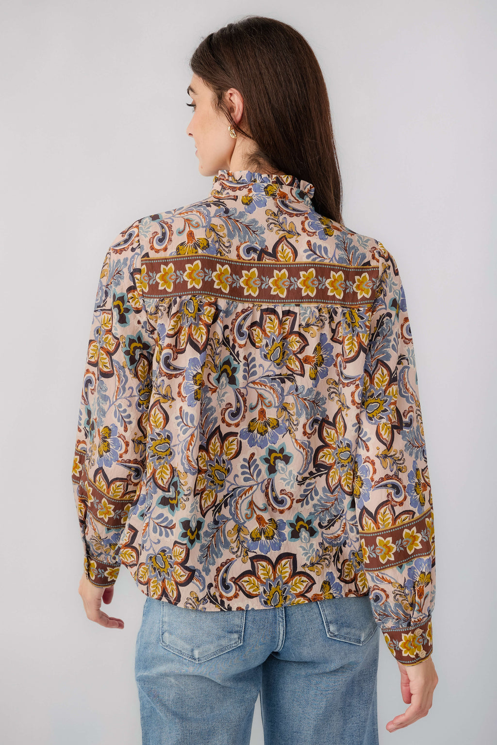 Beige button-down blouse back view with ruffle collar and ornate border paisley print