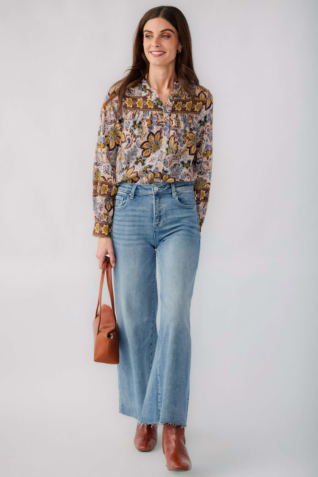 Beige printed ruffle-collar button-down blouse with long sleeves and border paisley print