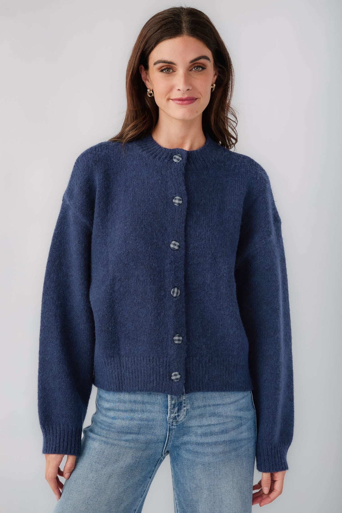 Navy cardigan with button front, ribbed knit hem, long sleeves