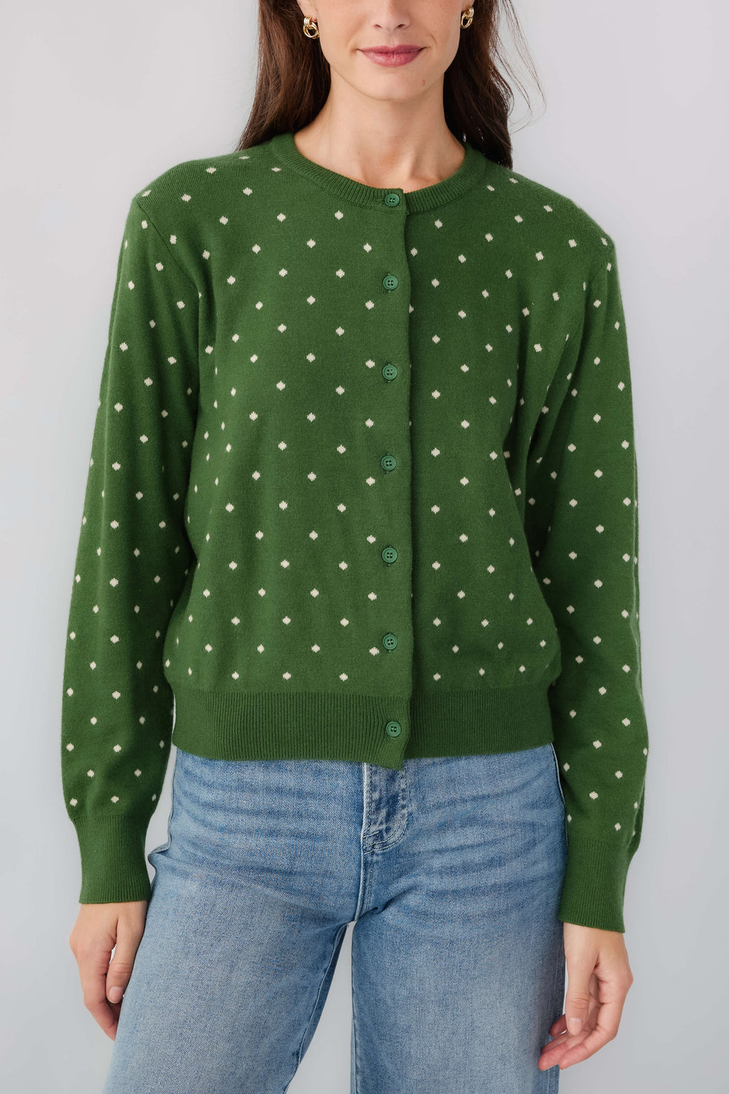 Green polka-dot cardigan with button front and long sleeves