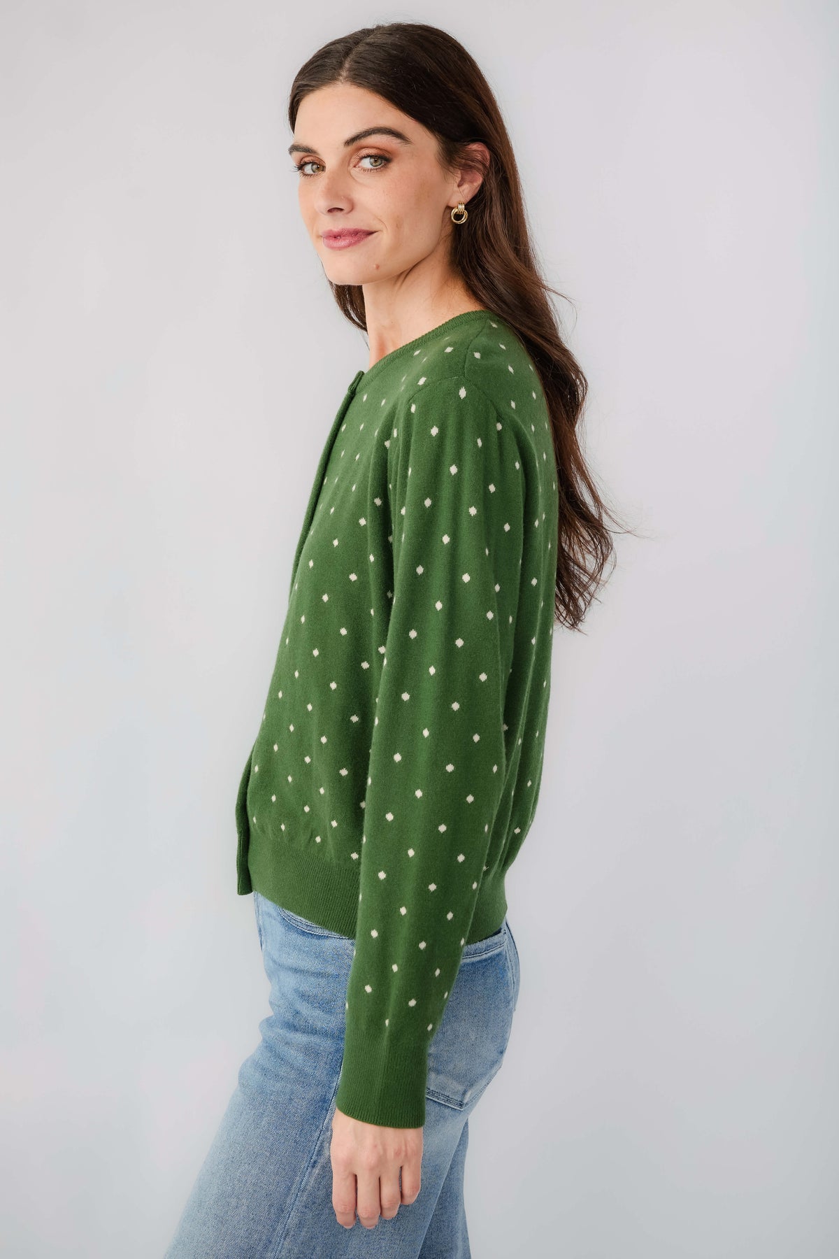 Green polka-dot cardigan, side view, long sleeves and button front