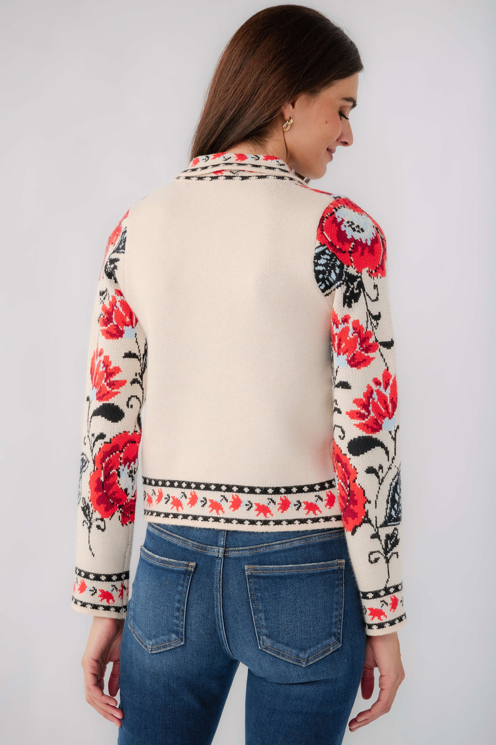 Cream floral cardigan back view with long sleeves, red rose print, patterned hem trim