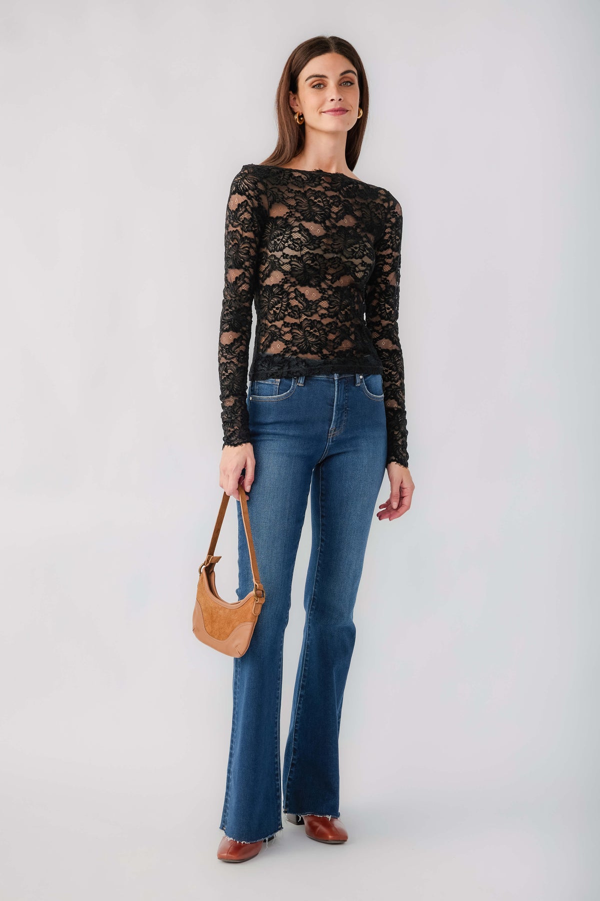 Black lace long-sleeve top with crew neckline and floral lace pattern, fitted look