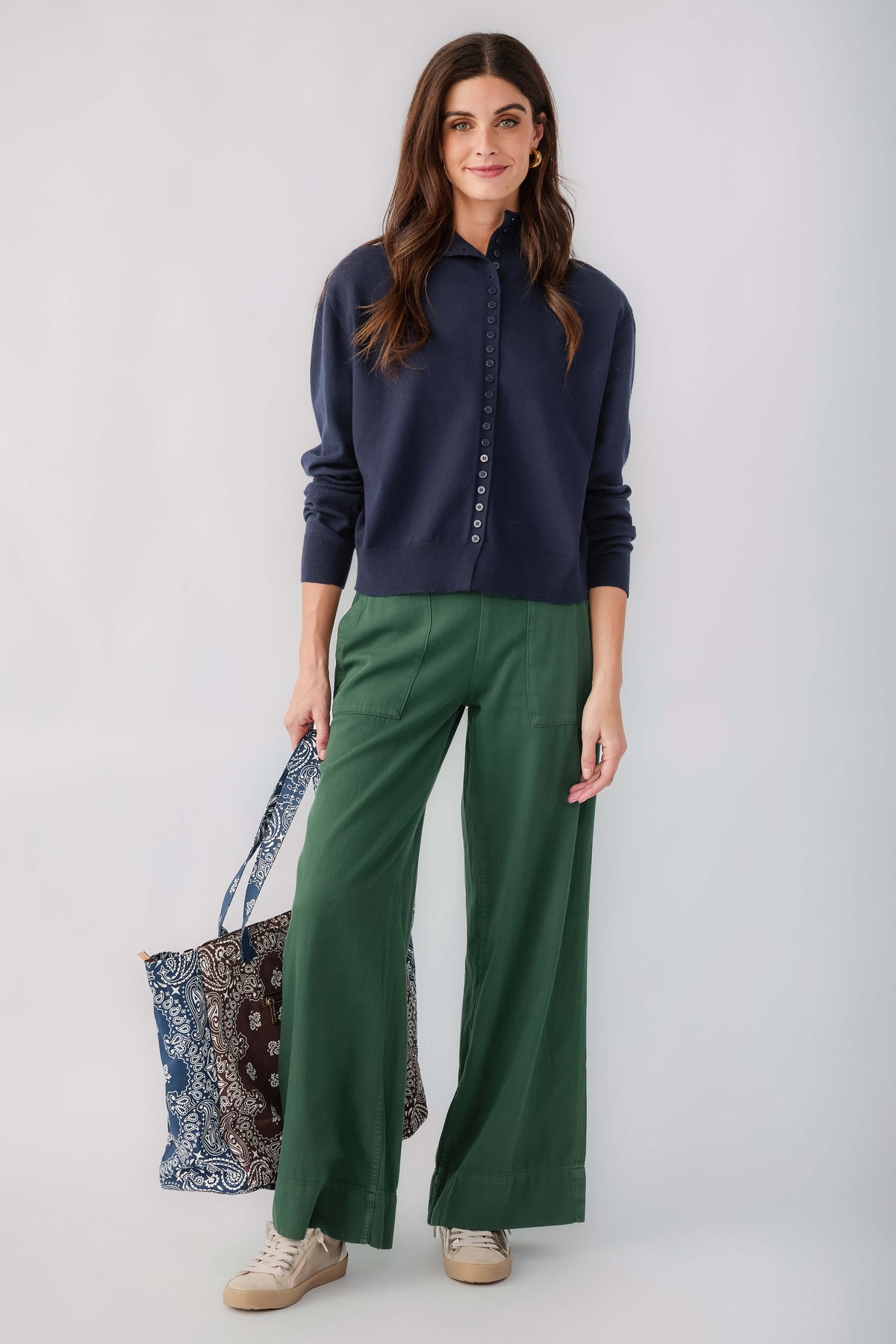 Dark navy mockneck cardigan with button front and relaxed fit, long sleeves