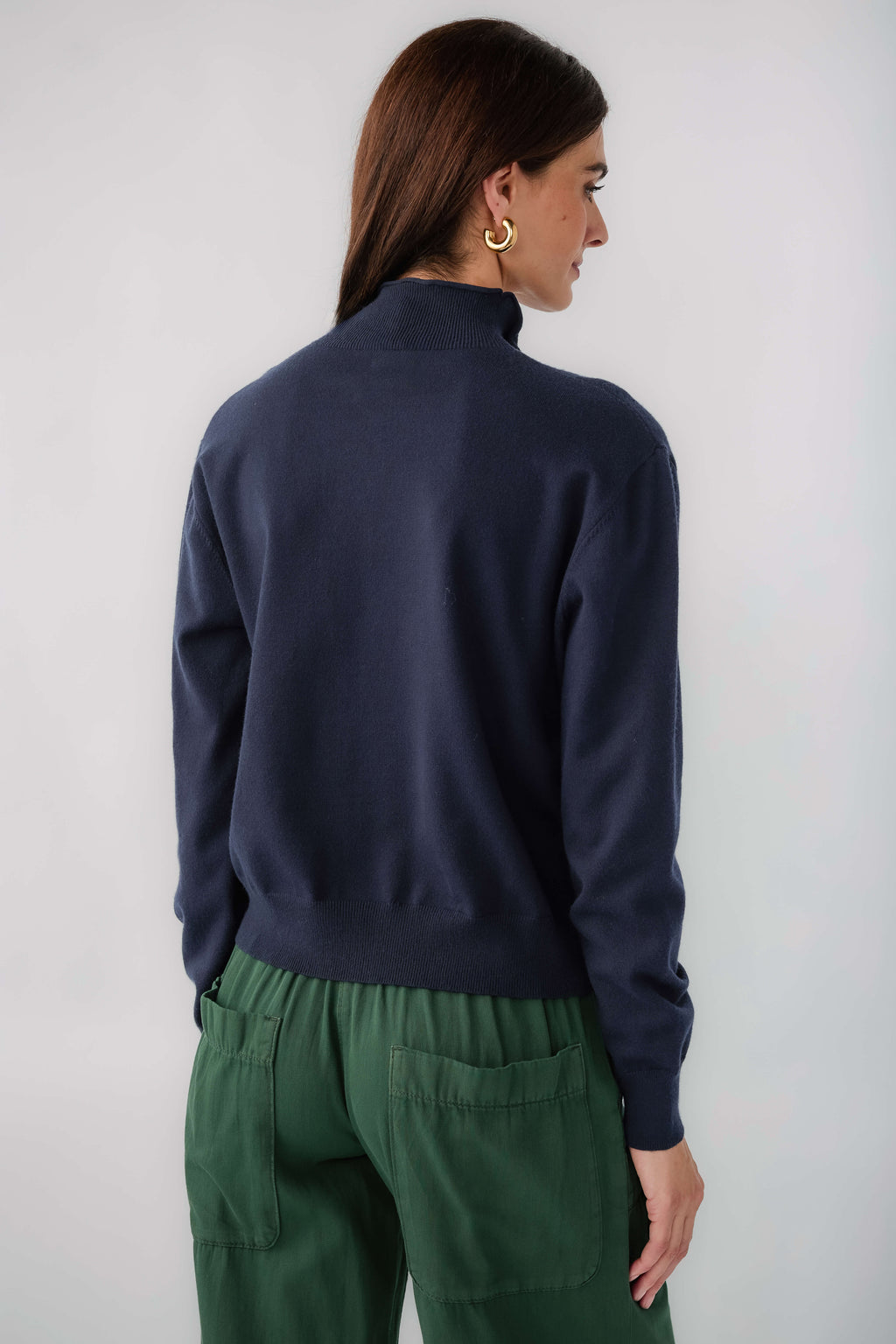 Dark navy mockneck cardigan, back view, long sleeves with ribbed cuffs