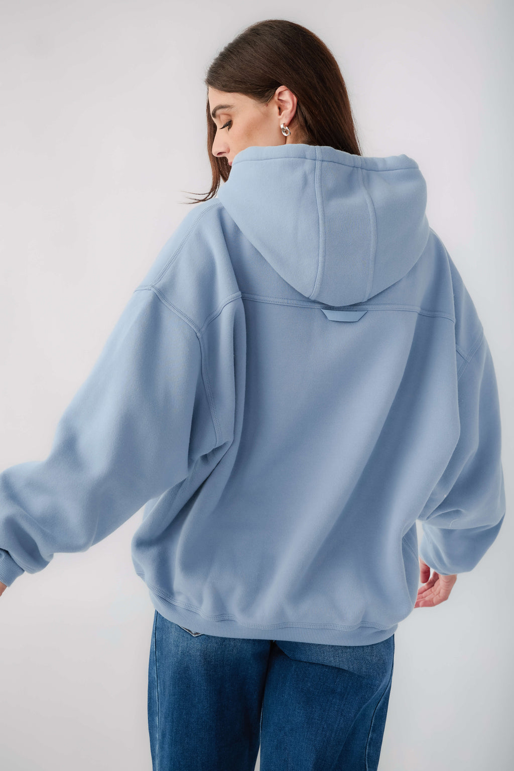 Light blue pullover hoodie with drawstring hood and kangaroo pocket, back view
