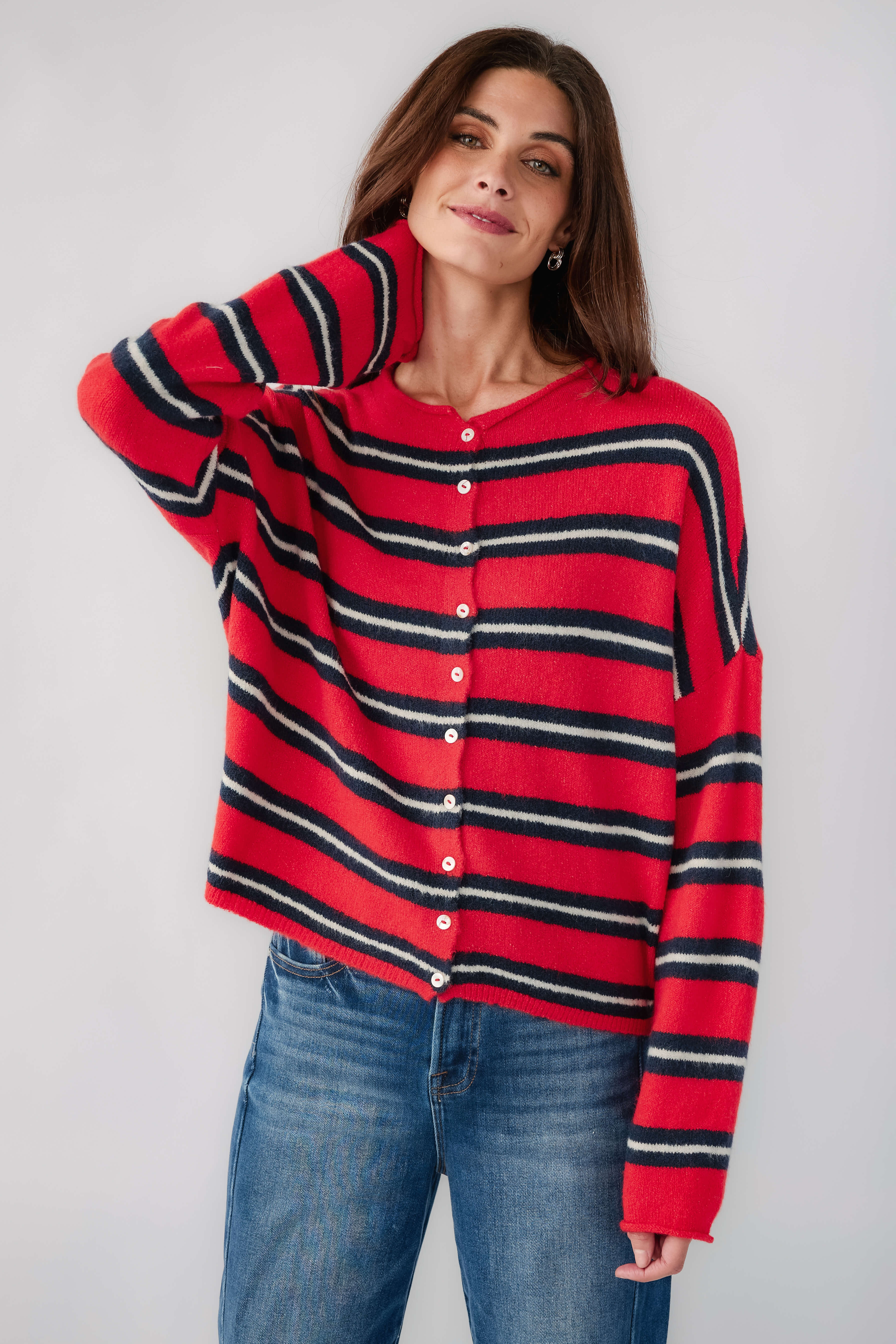Women’s striped piper cardigan with long sleeves, red cuffs, and dark striped pattern