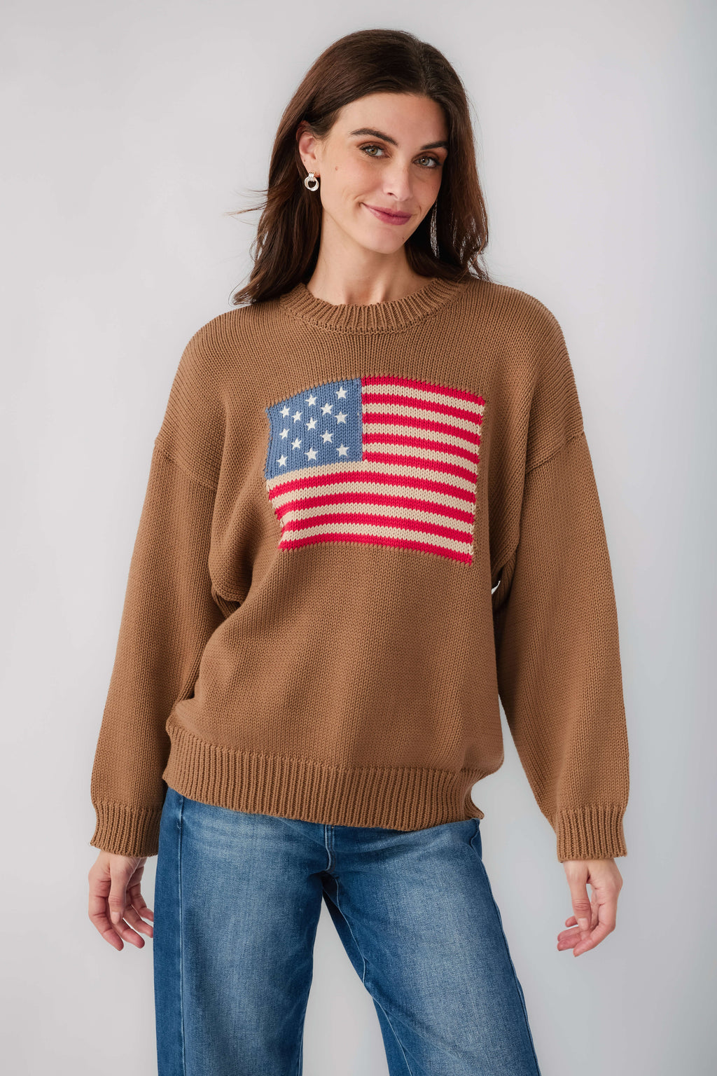 Olive brown crewneck sweater with American flag graphic across the chest