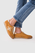 Sam Edelman Vintage Mustard low-top lace-up sneakers with white logo and tan rubber sole