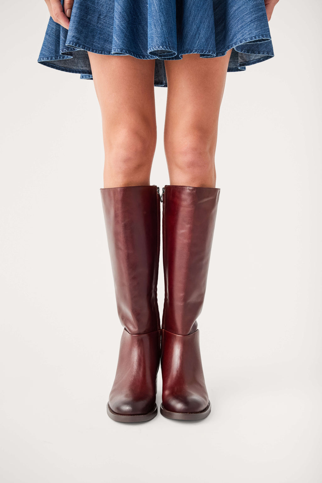 Dark brown leather knee-high boots with low stacked heel, pull-on shaft